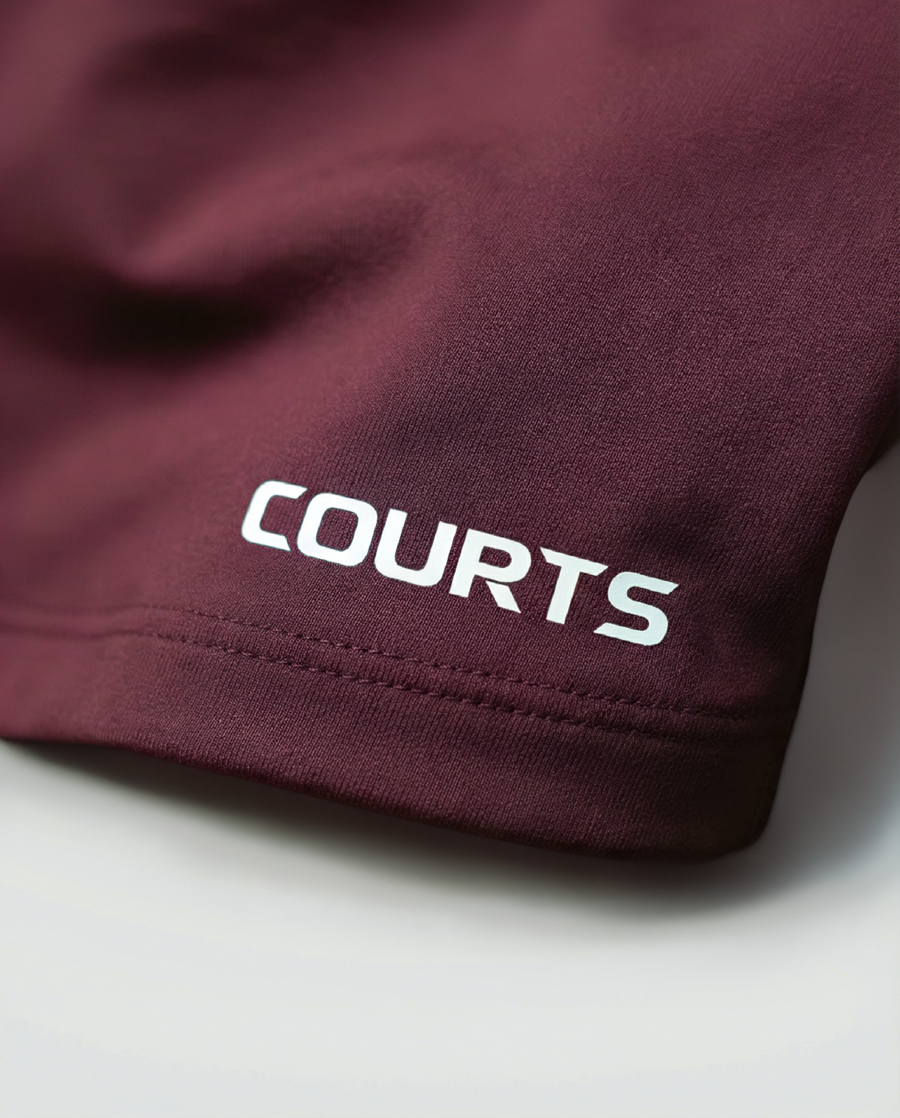 Courts grape purple - maroon athletic crop top and leggings on a mannequin against a white background