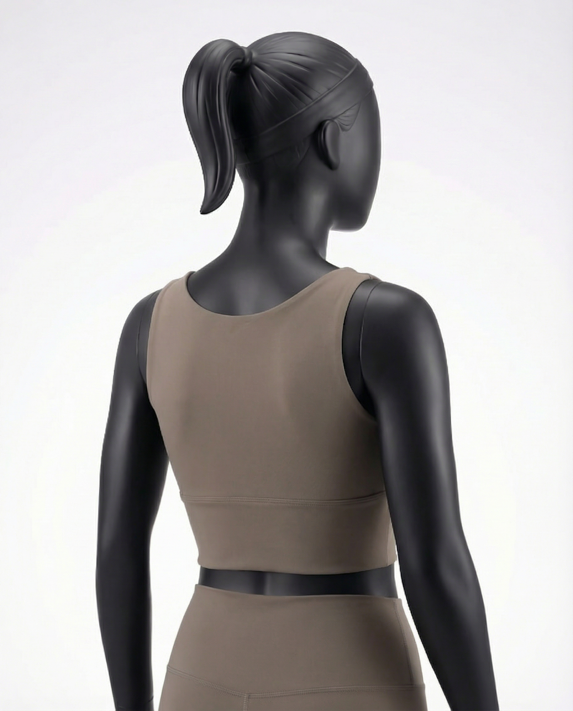 Mannequin wearing a beige khaki athletic top with a zipper on a white background
Courts Sport