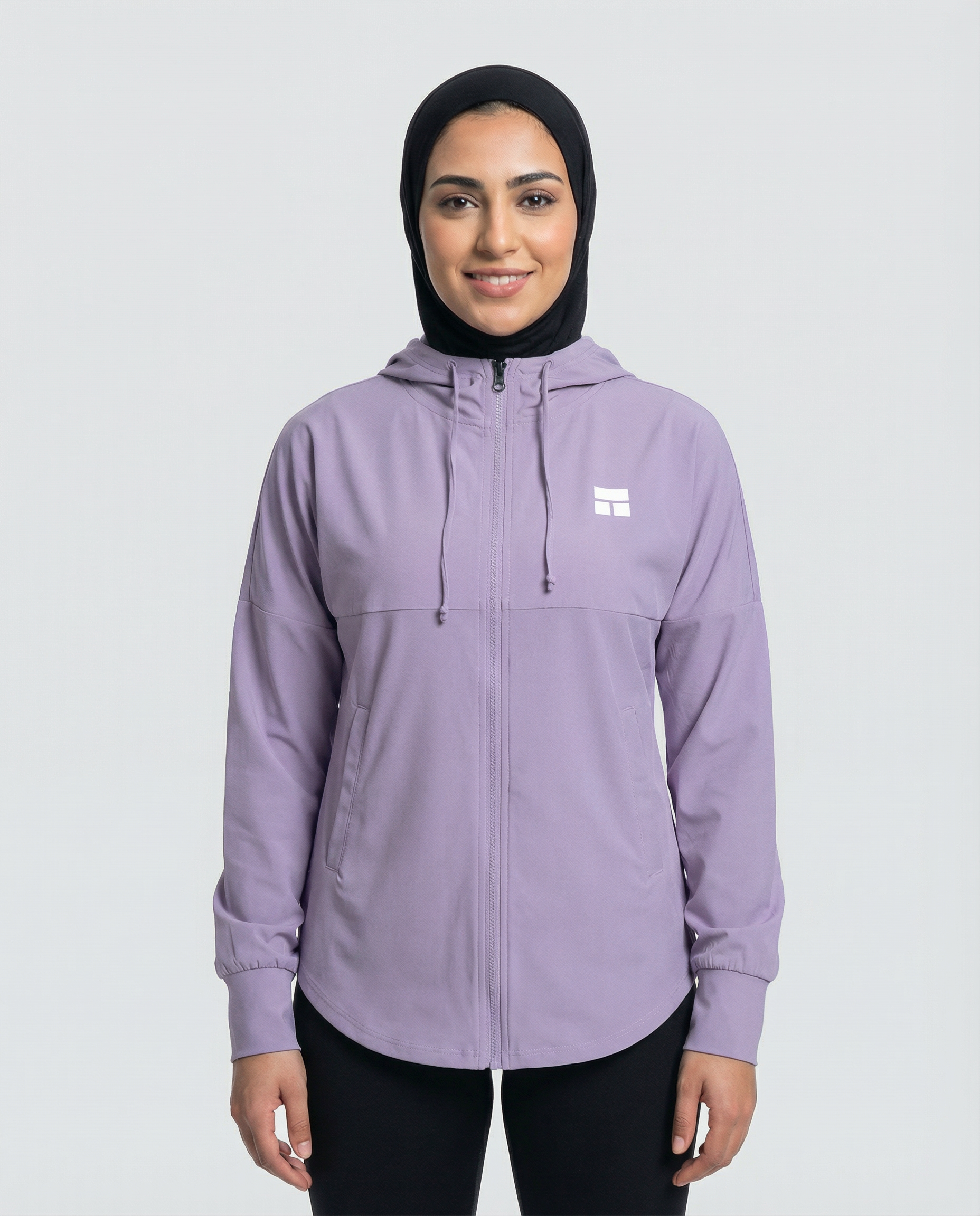 Woman wearing a purple hoodie with a brand logo on a white background