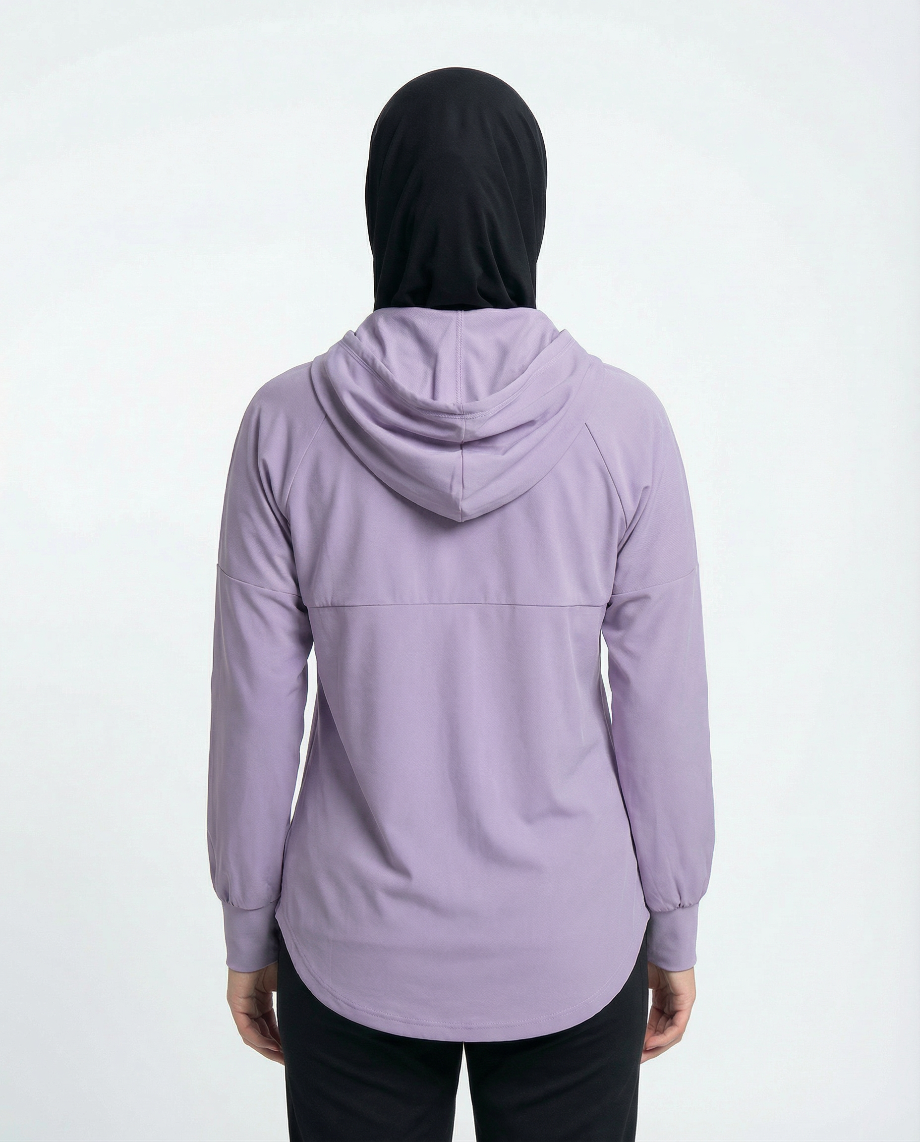 Woman wearing a purple hoodie with a brand logo on a white background
