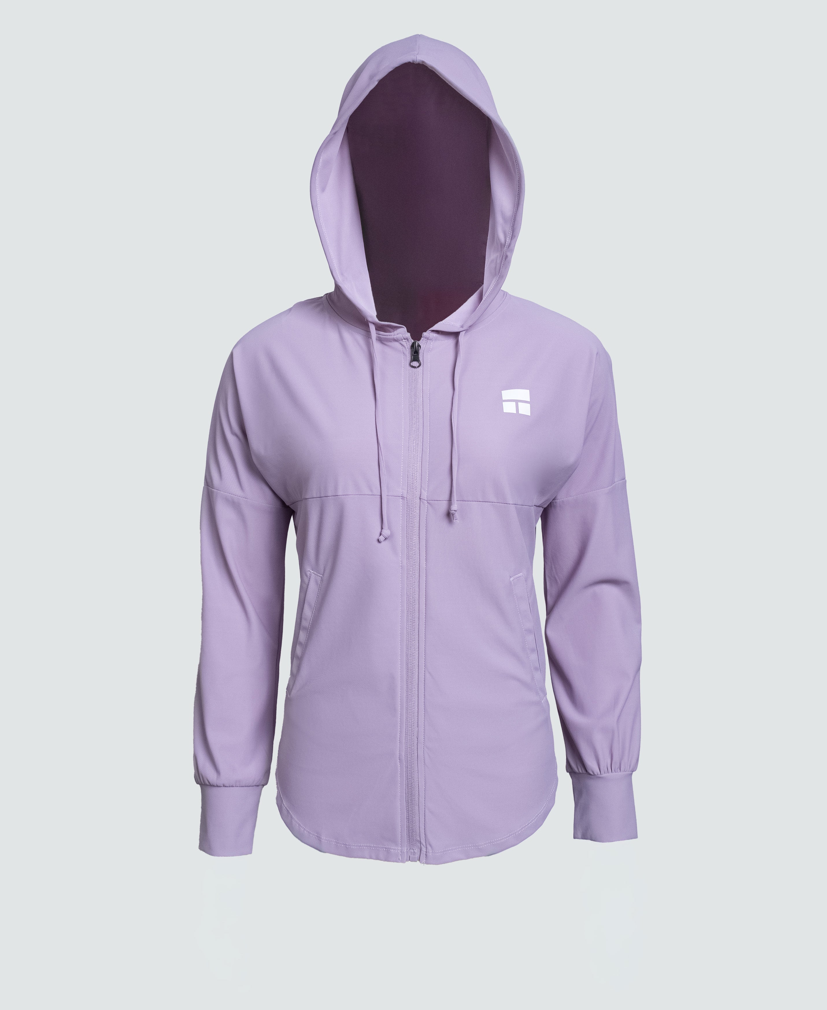 Woman wearing a purple hoodie with a brand logo on a white background