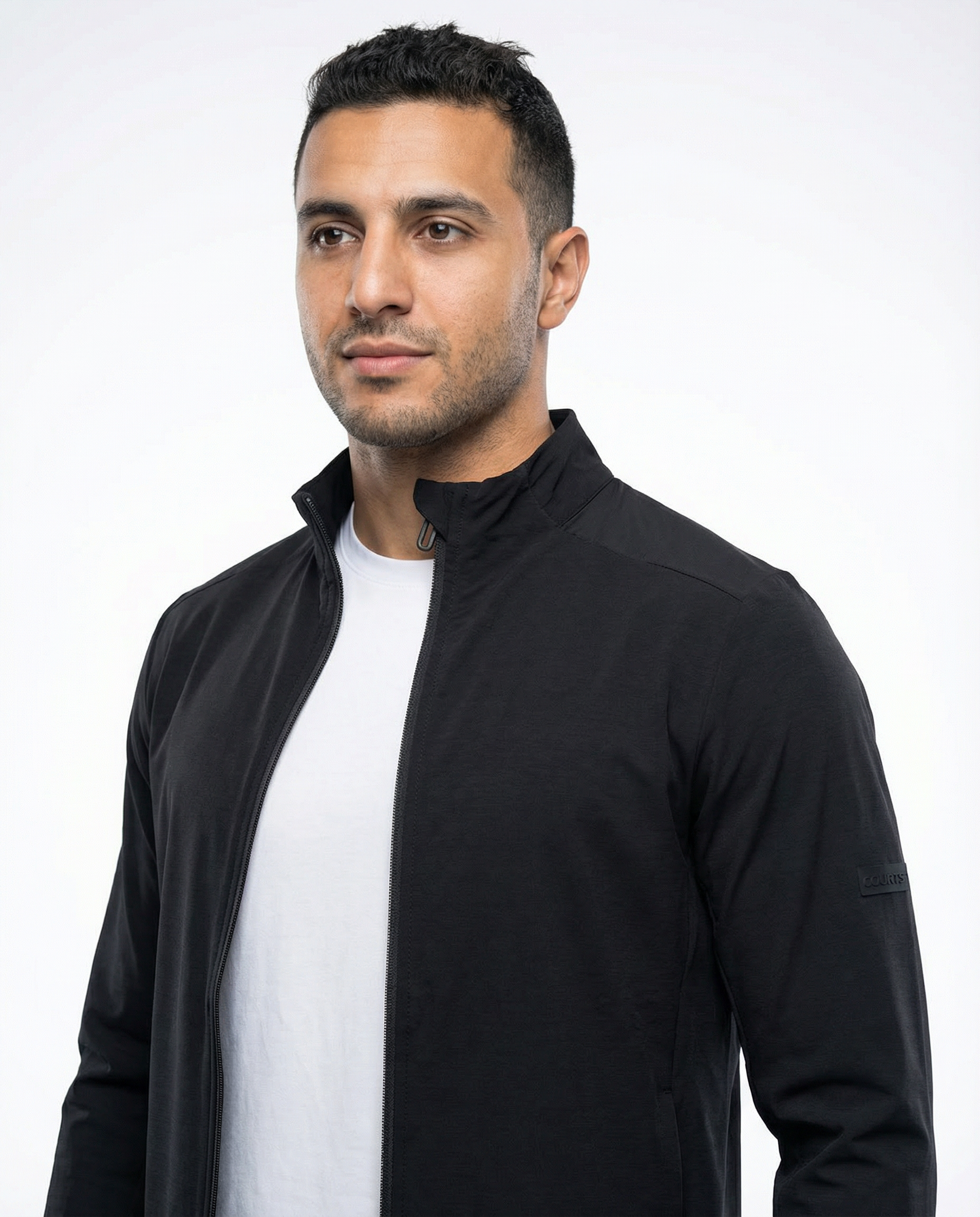 Man wearing a black jacket on a white background
Courts Sport