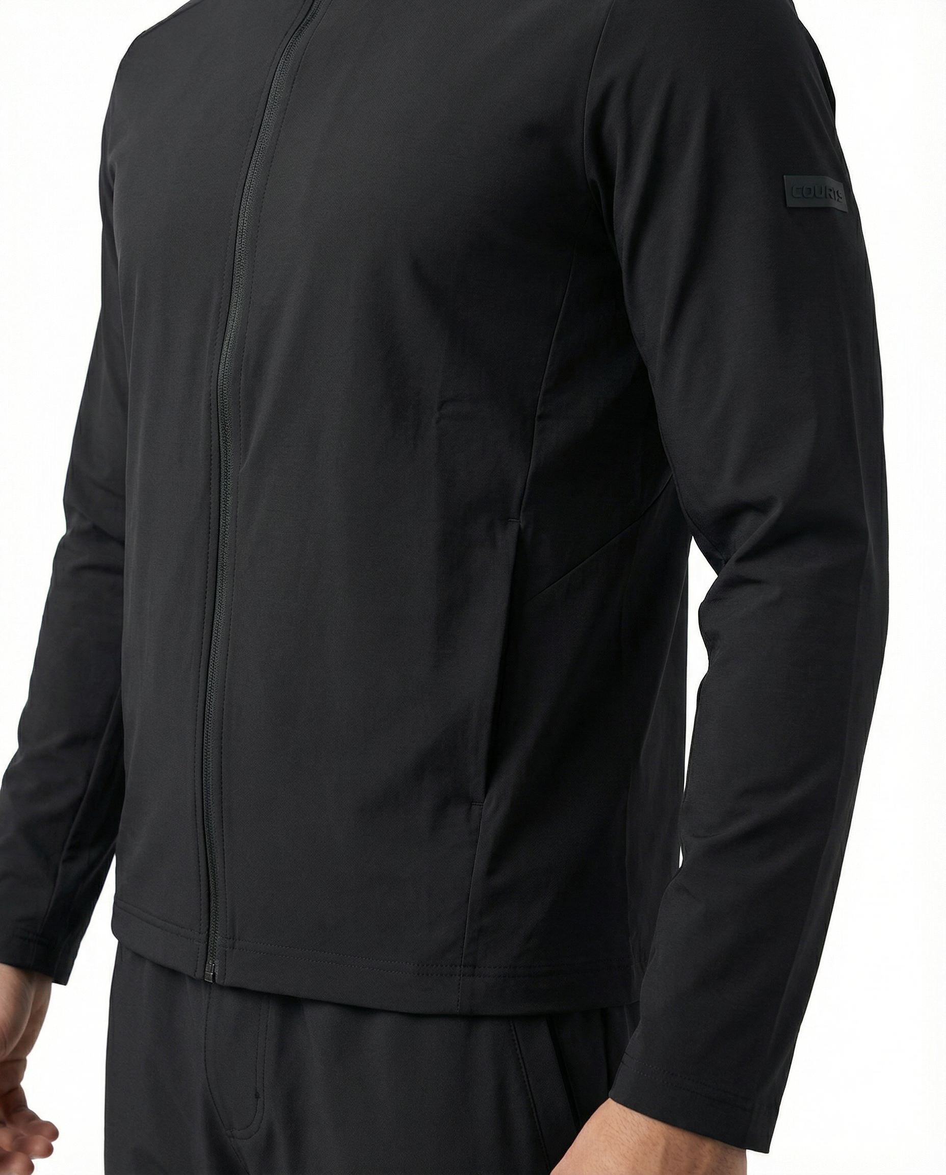 Man wearing a black jacket on a white background
Courts Sport