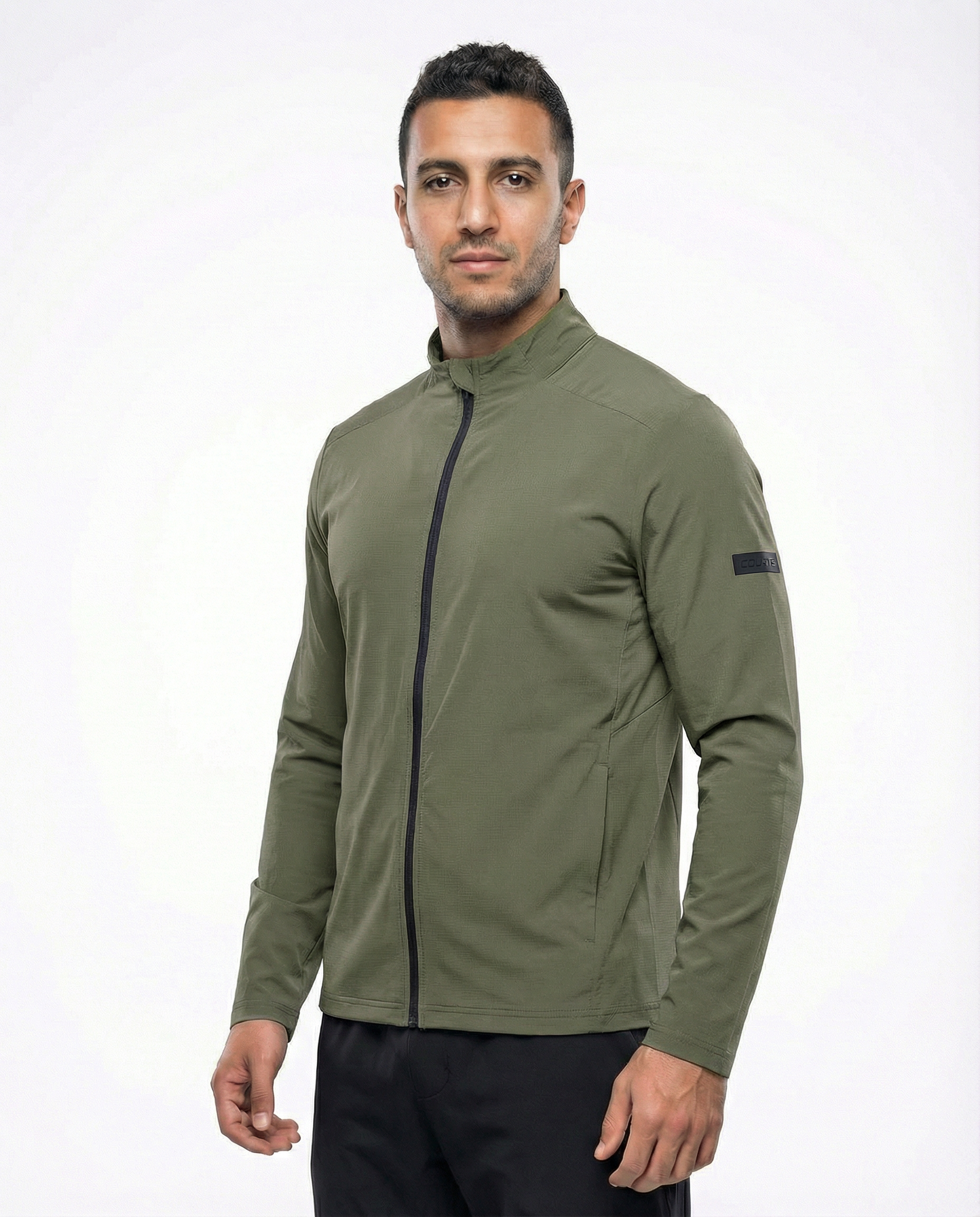 Man wearing a green jacket on a white background
Courts Sport