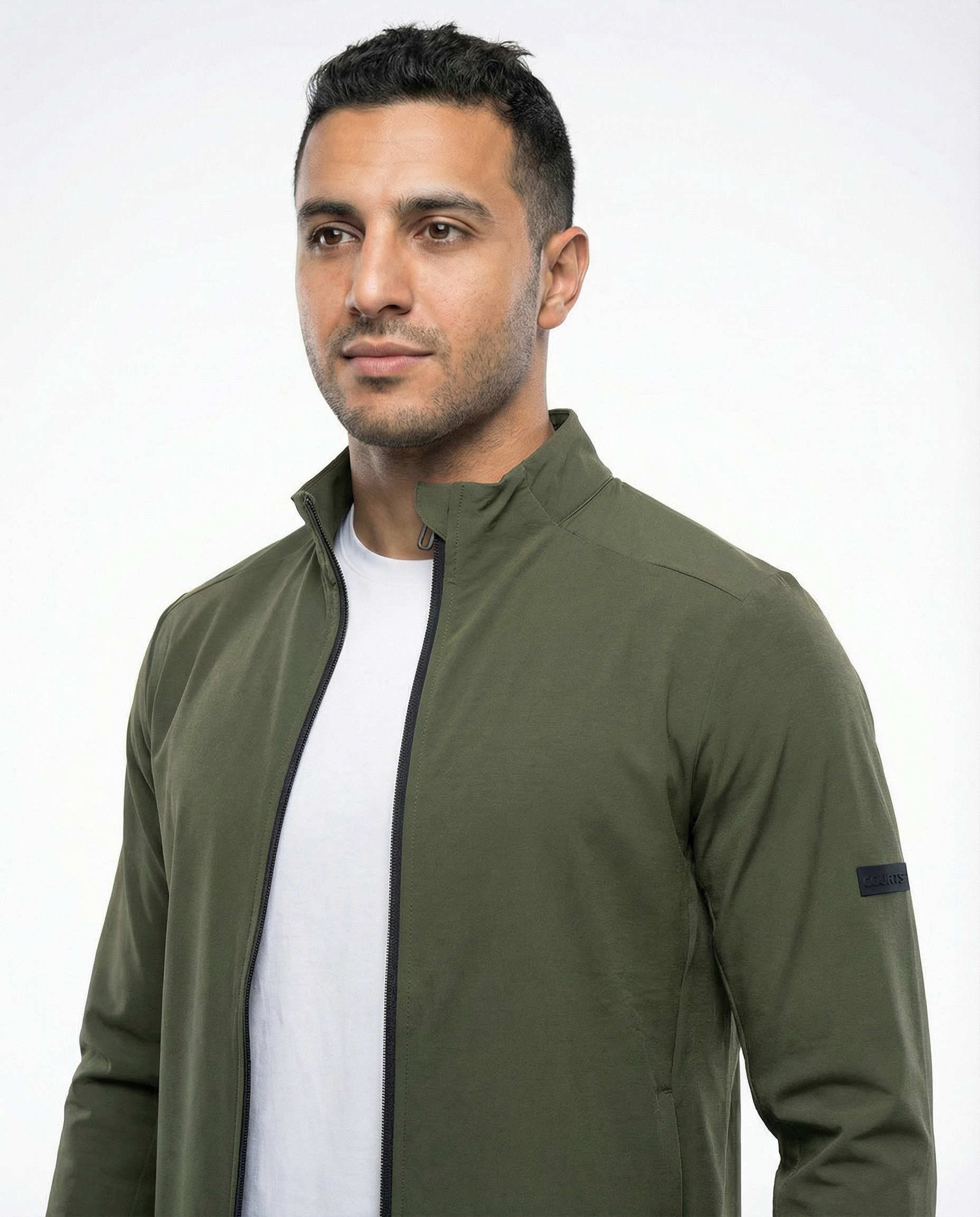 Man wearing a green jacket on a white background
Courts Sport