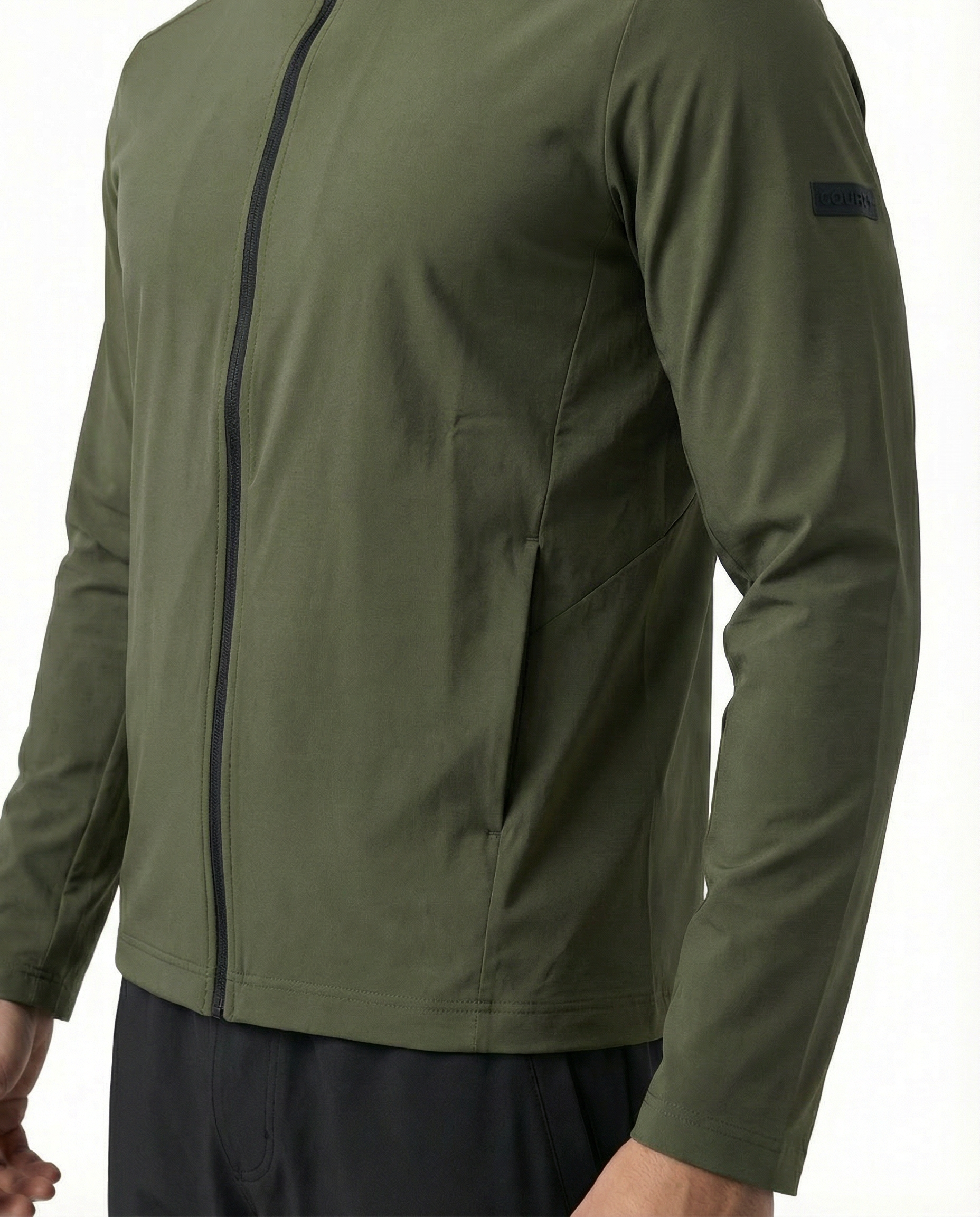 Man wearing a green jacket on a white background
Courts Sport