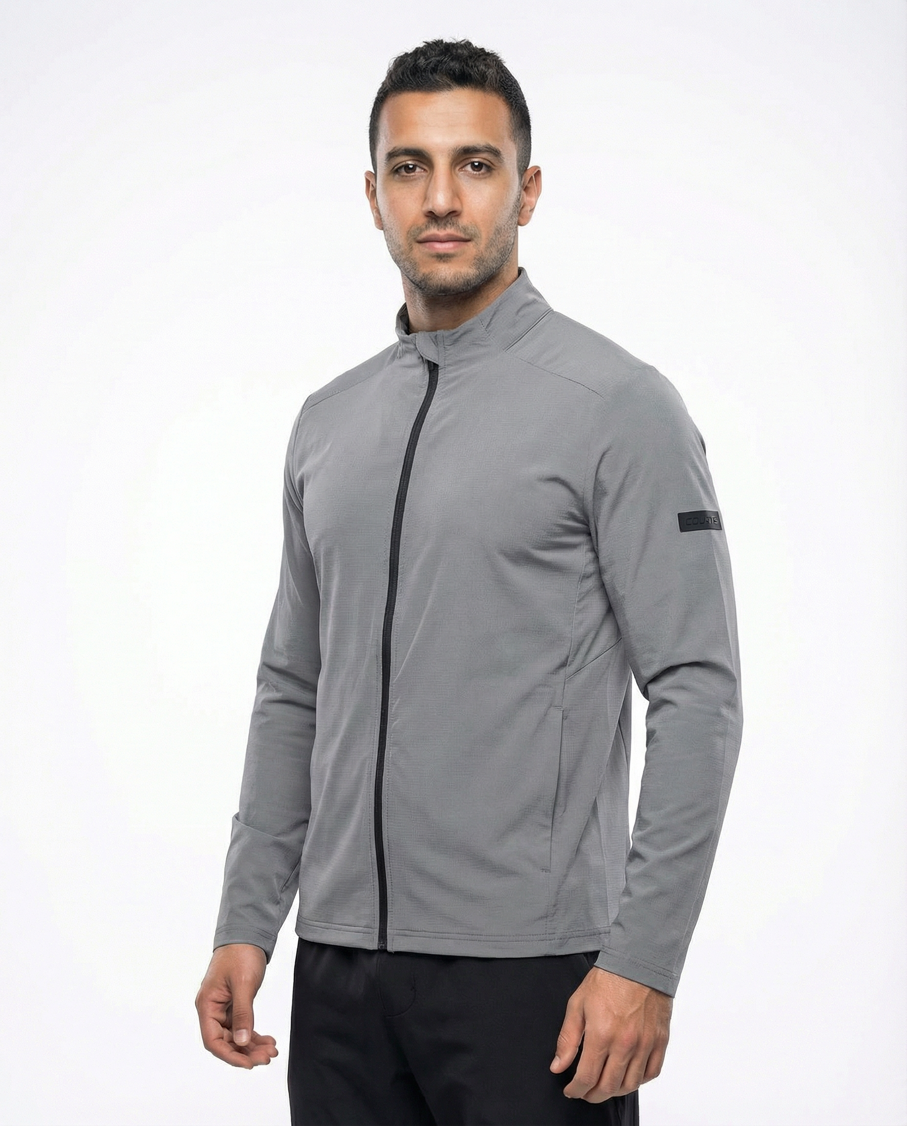 Man wearing a grey jacket on a white background
Courts Sport