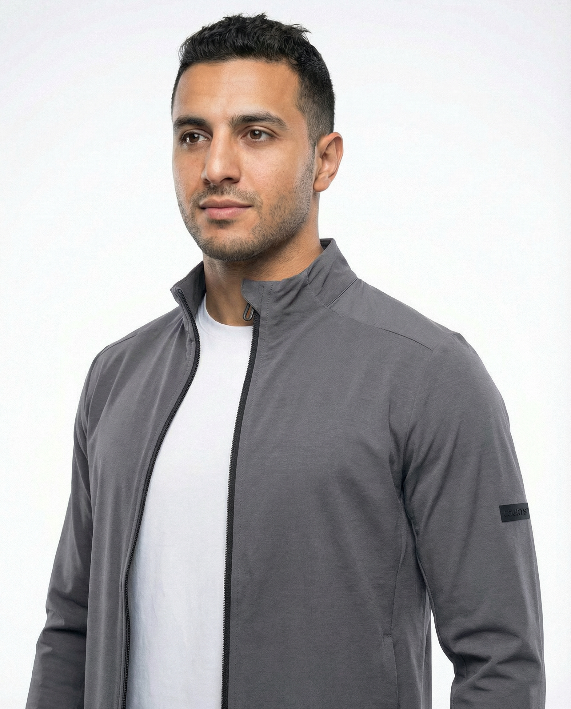 Man wearing a grey jacket on a white background
Courts Sport