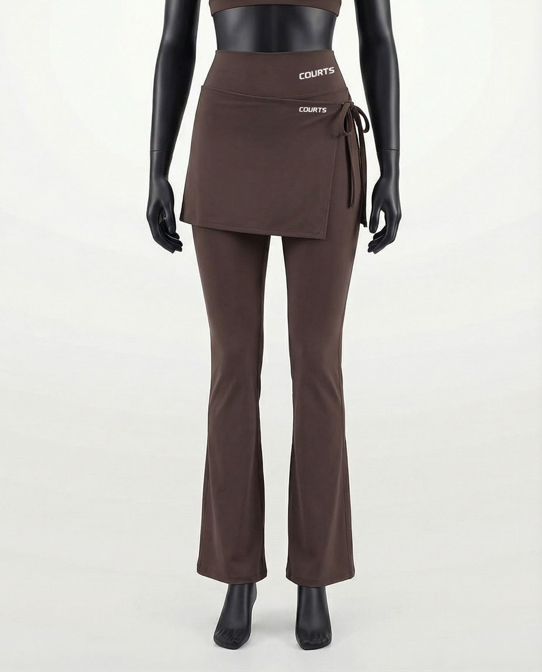Mannequin wearing a brown skirt and pants with 'Courts' branding on a white background
