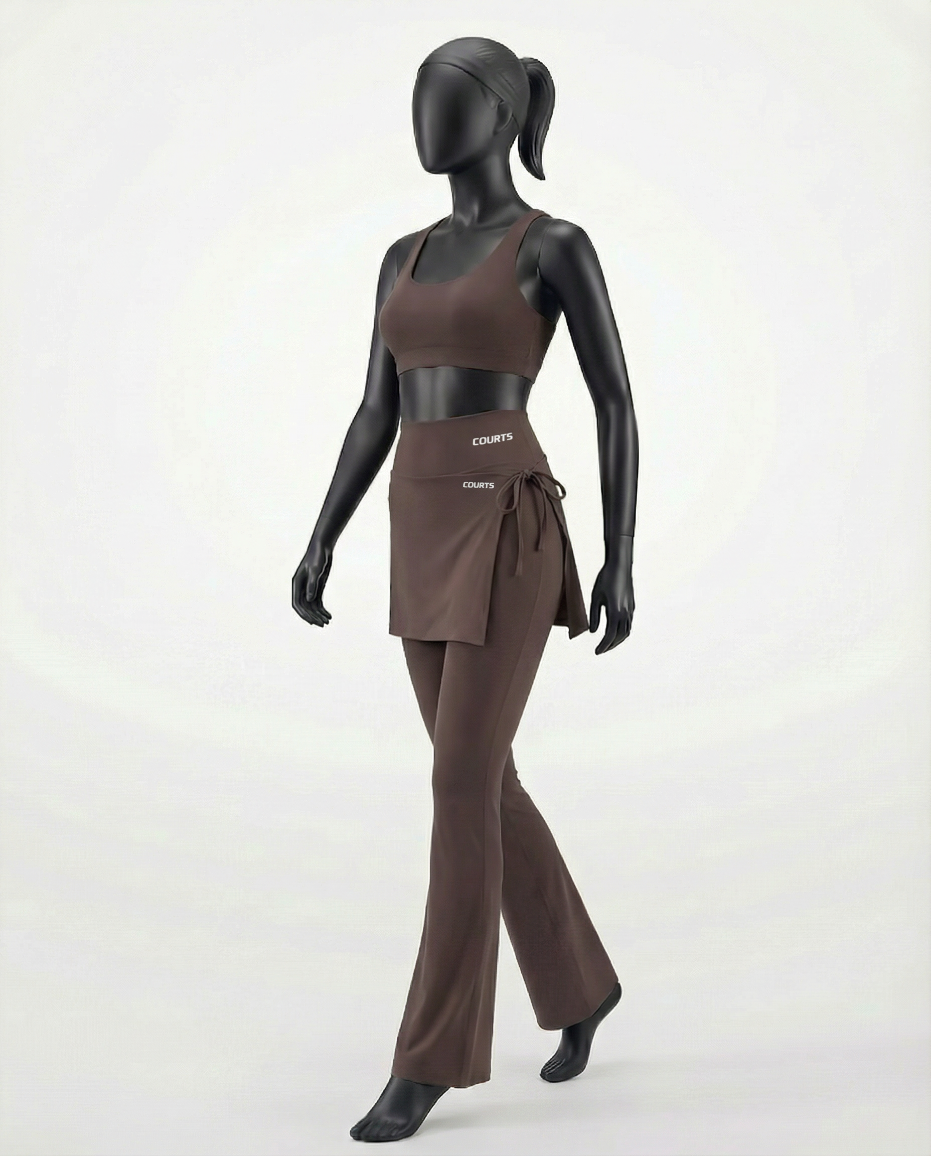 Mannequin wearing a brown skirt and pants with 'Courts' branding on a white background