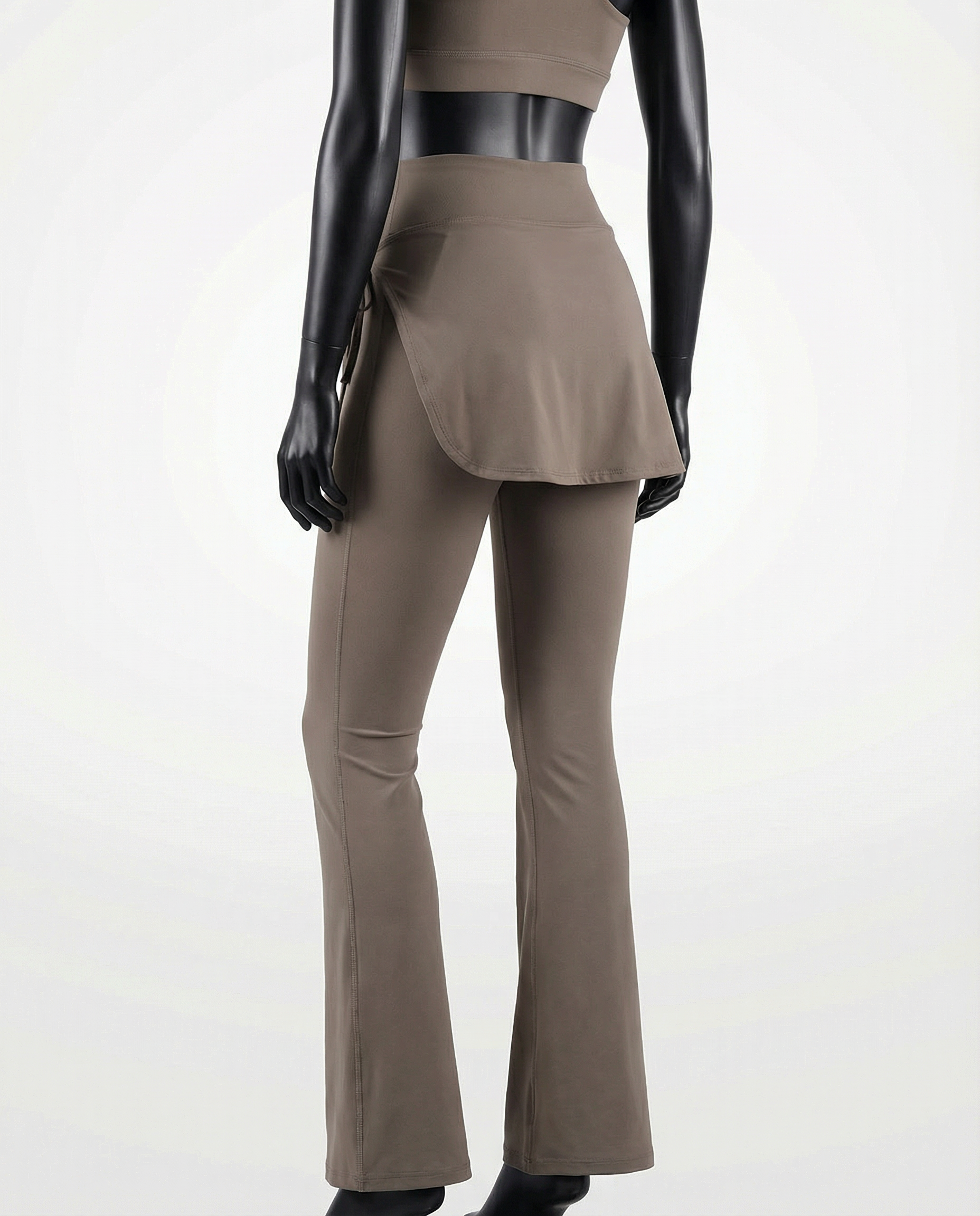 Mannequin wearing a khaki brown skirt and pants with 'Courts' branding on a white background
