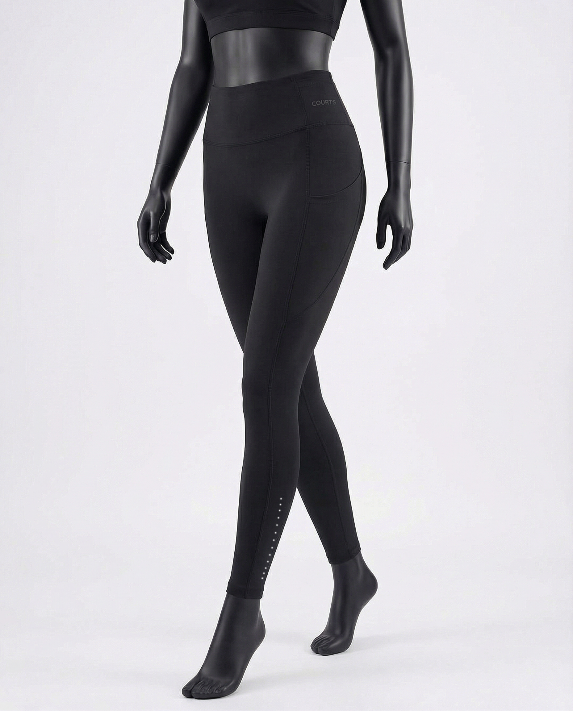 Courts black leggings worn by a mannequin on a white background