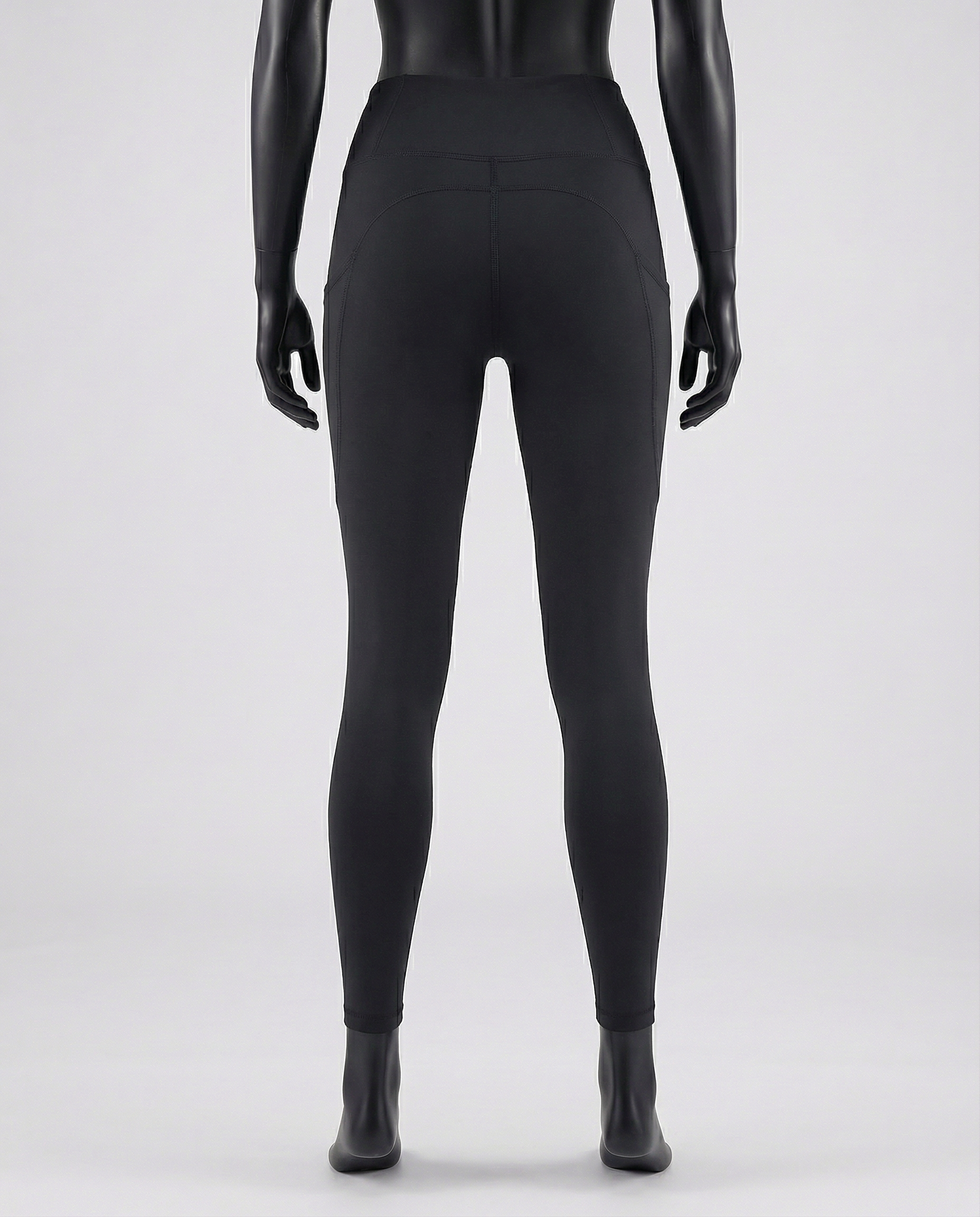 Courts black leggings worn by a mannequin on a white background