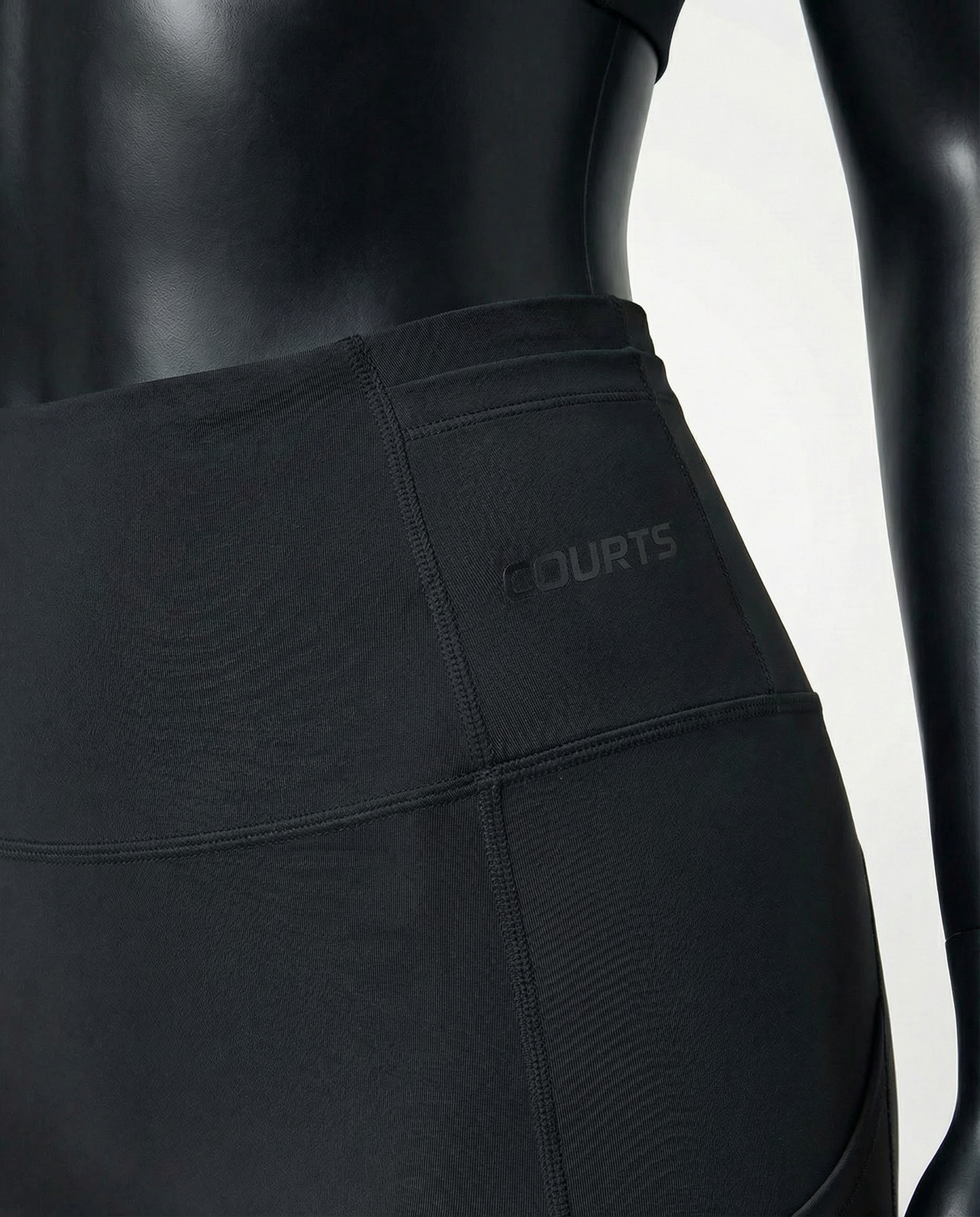 Courts black leggings worn by a mannequin on a white background