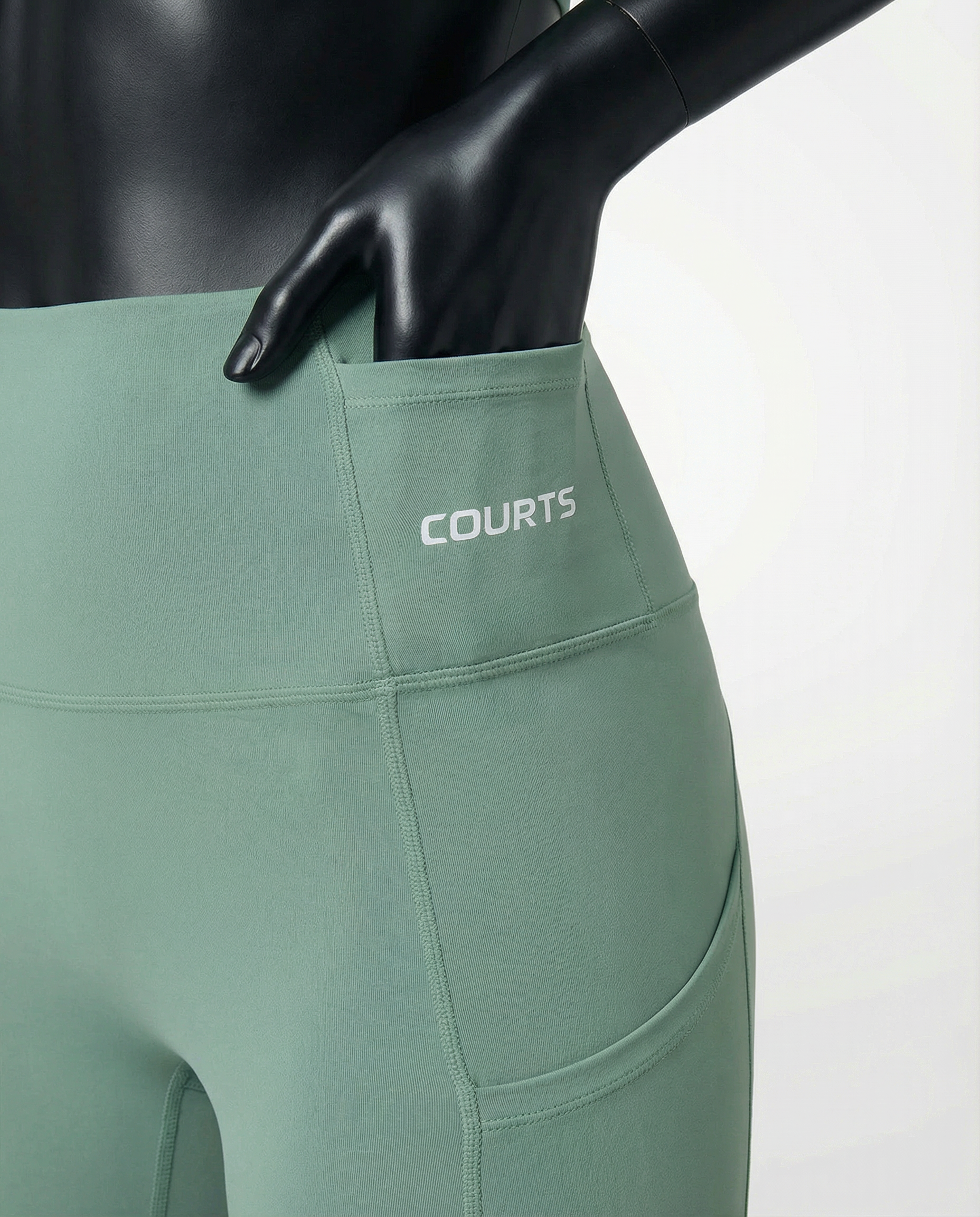 Courts light mint green leggings worn by a mannequin on a white background