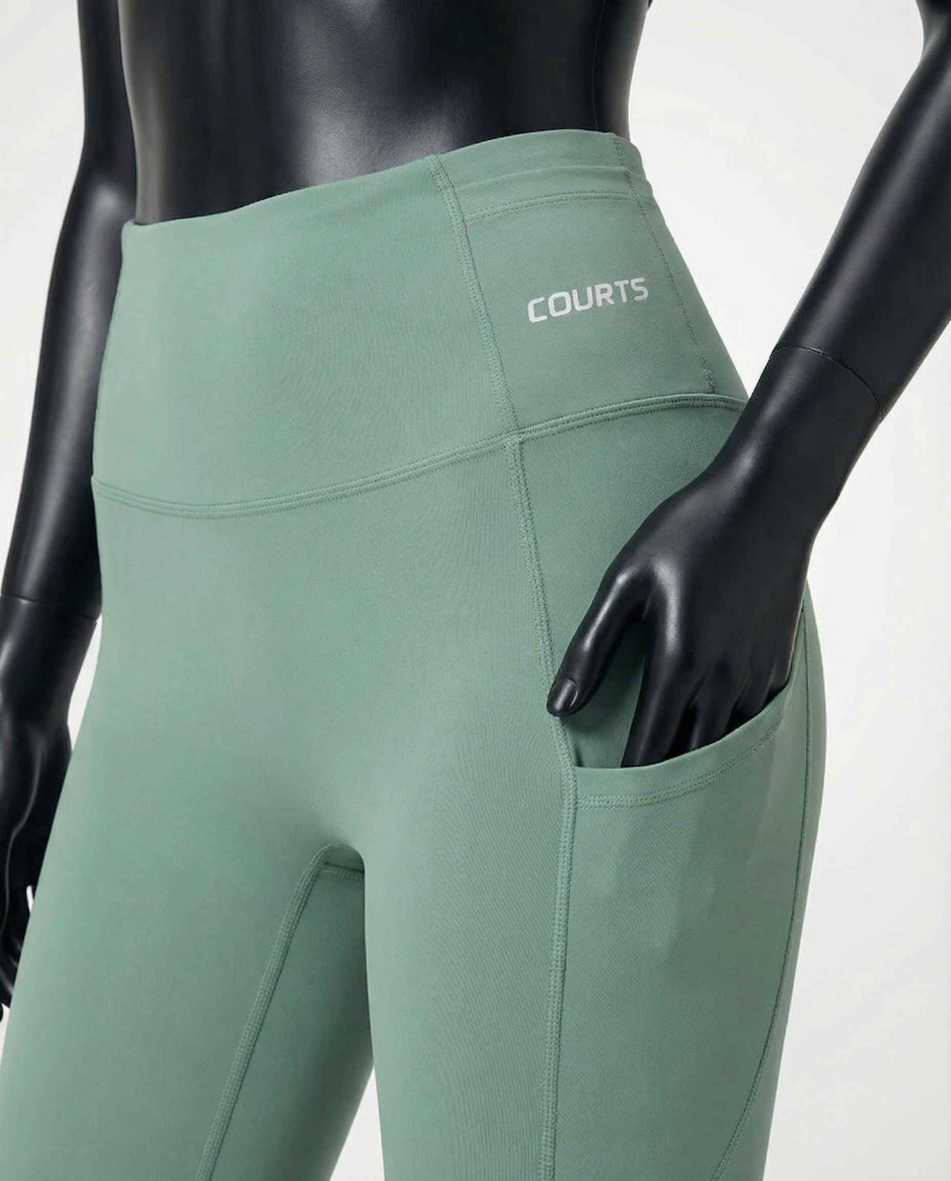 Courts light mint green leggings worn by a mannequin on a white background