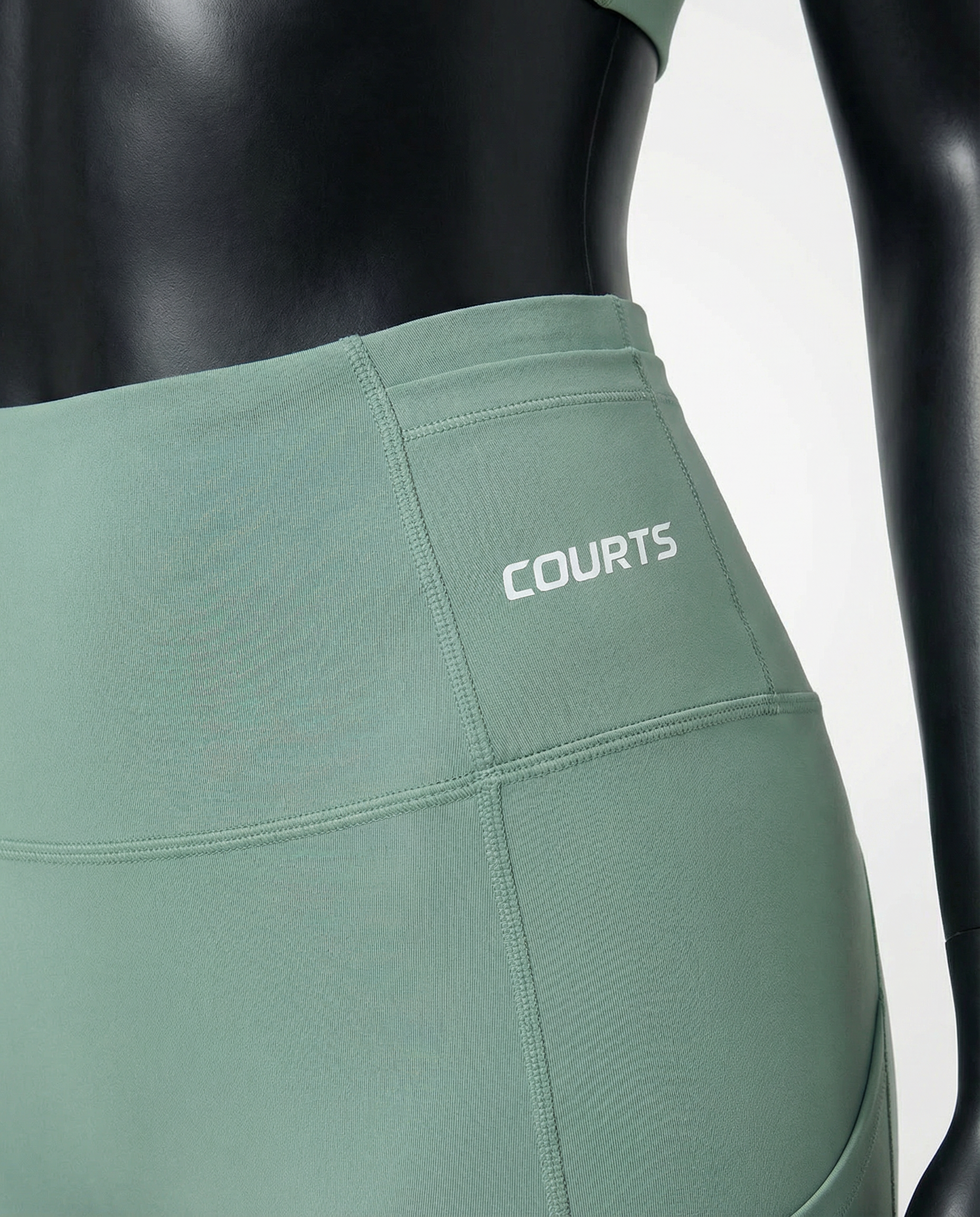 Courts light mint green leggings worn by a mannequin on a white background
