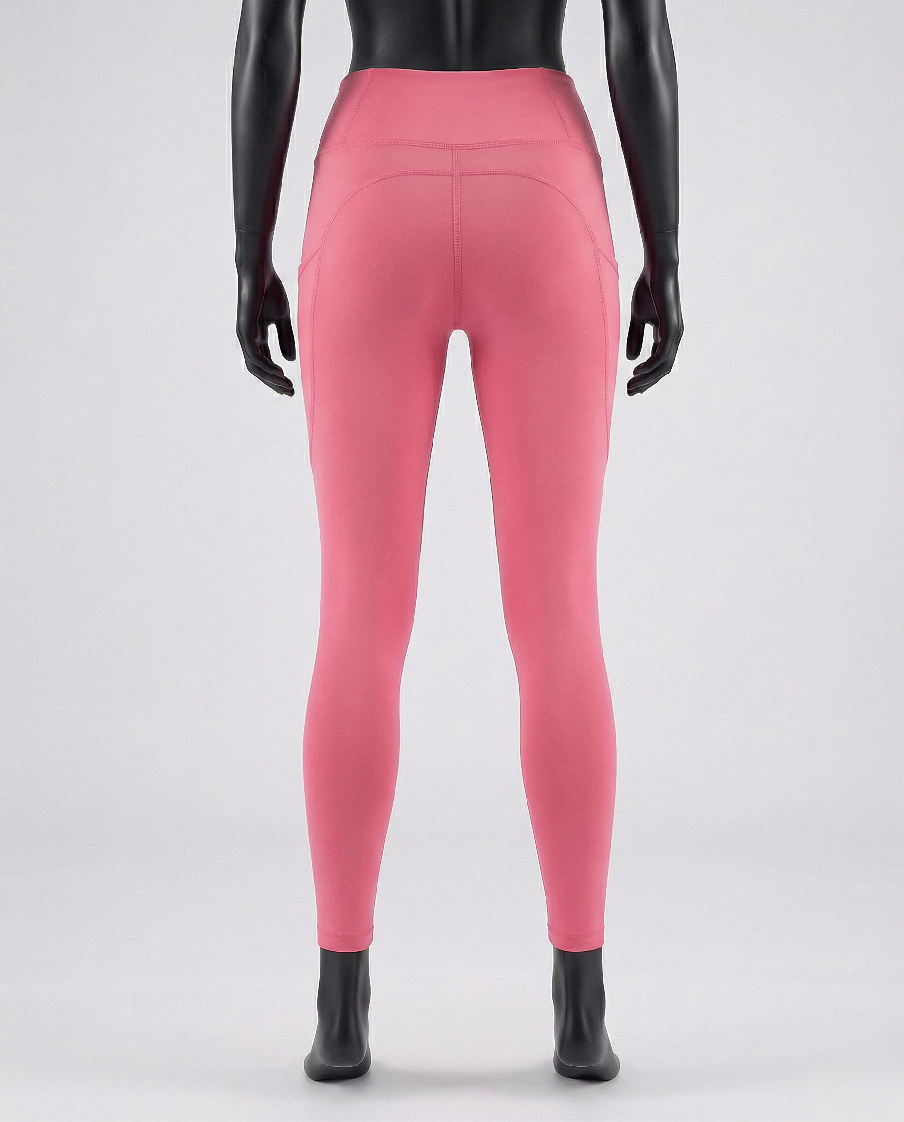Pink leggings worn by a mannequin on a white background