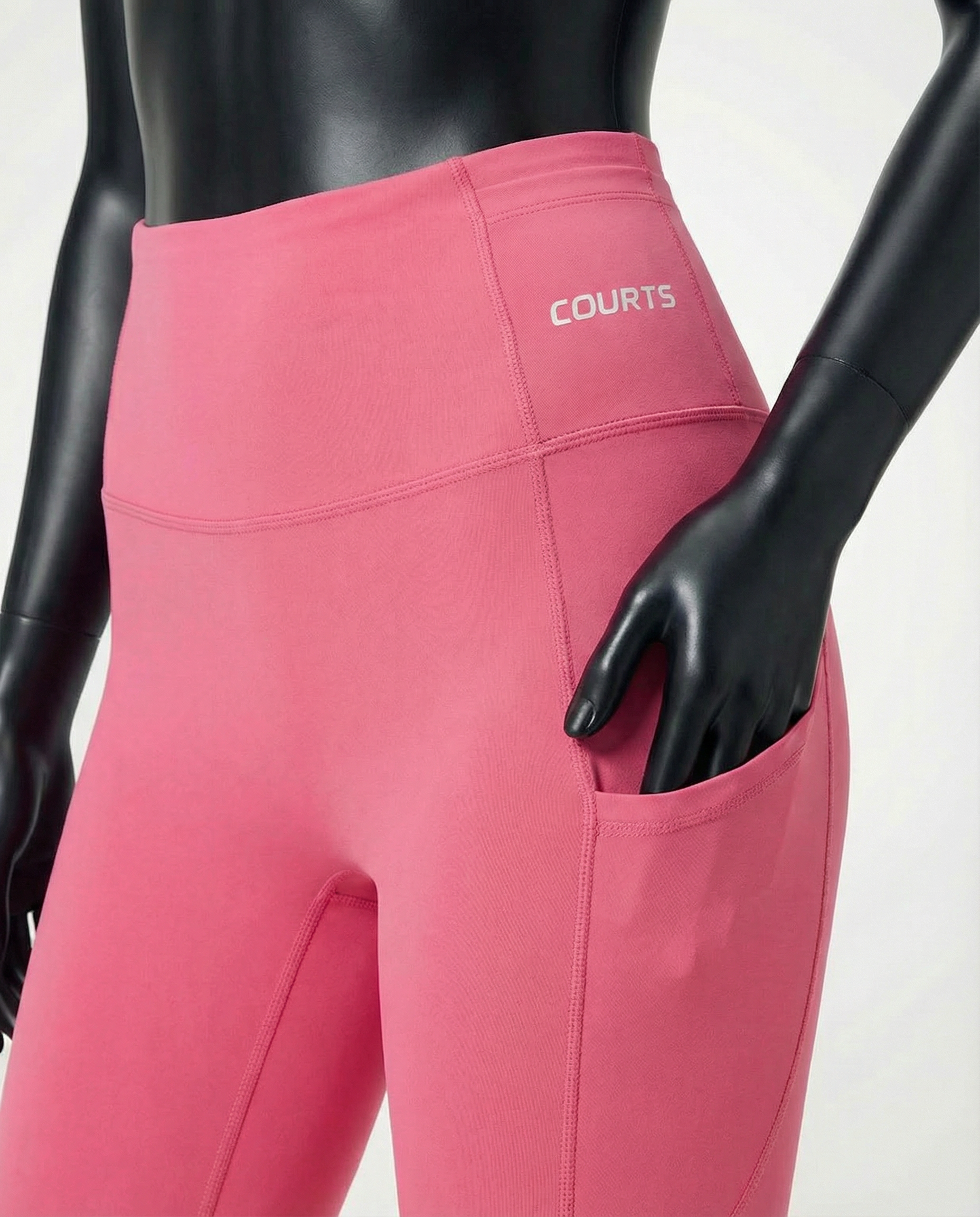 Courts pink leggings worn by a mannequin on a white background