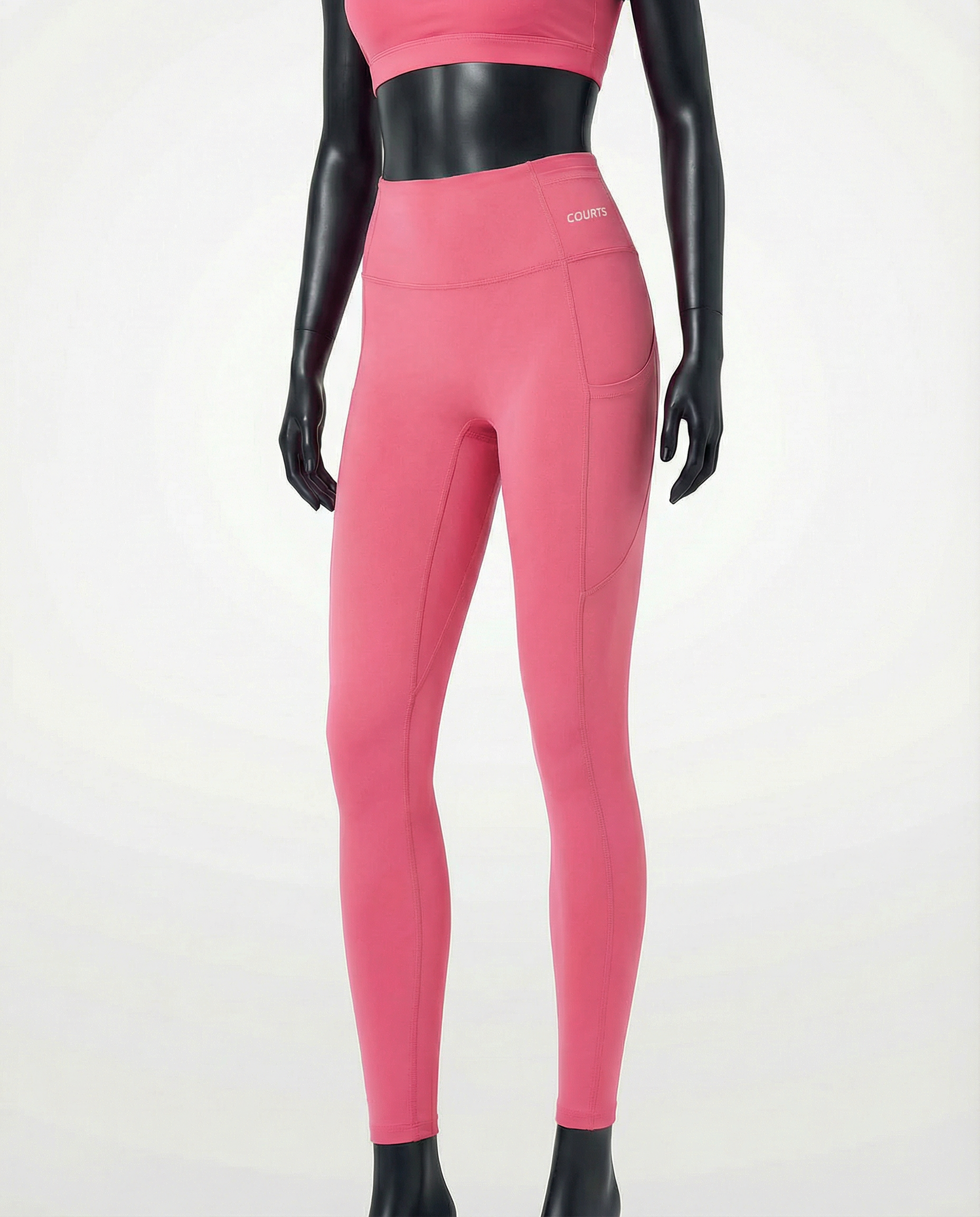 Courts pink leggings worn by a mannequin on a white background