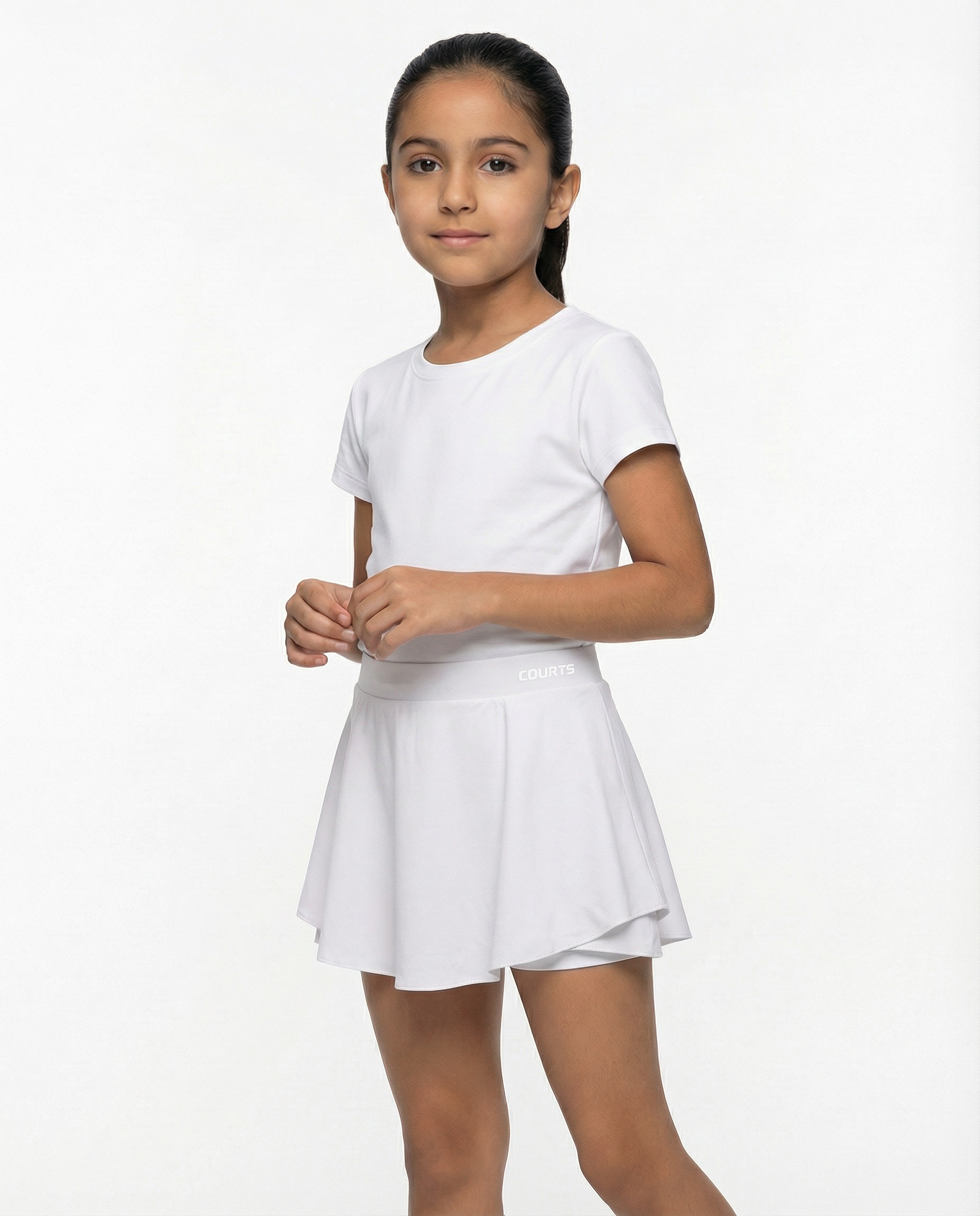 Young girl wearing a white t-shirt and white skirt skort short on a white background
Courts Sport