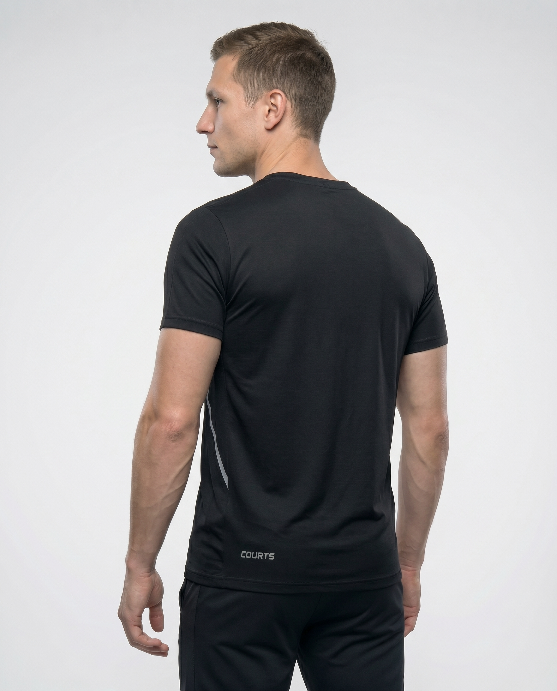 Man wearing a black athletic outfit with a logo on a white background
Courts Sport