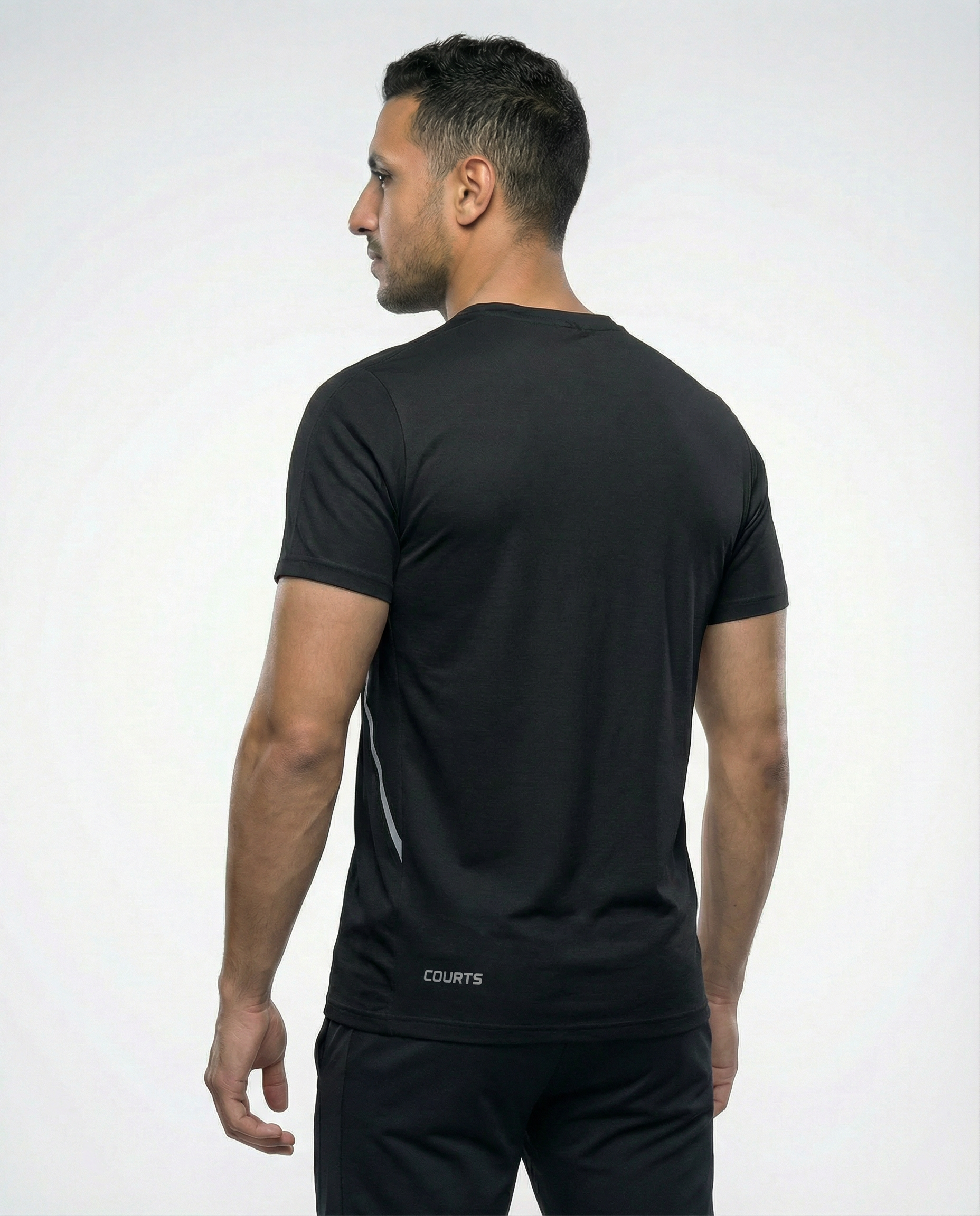 Man wearing a black athletic outfit with a logo on a white background
Courts Sport