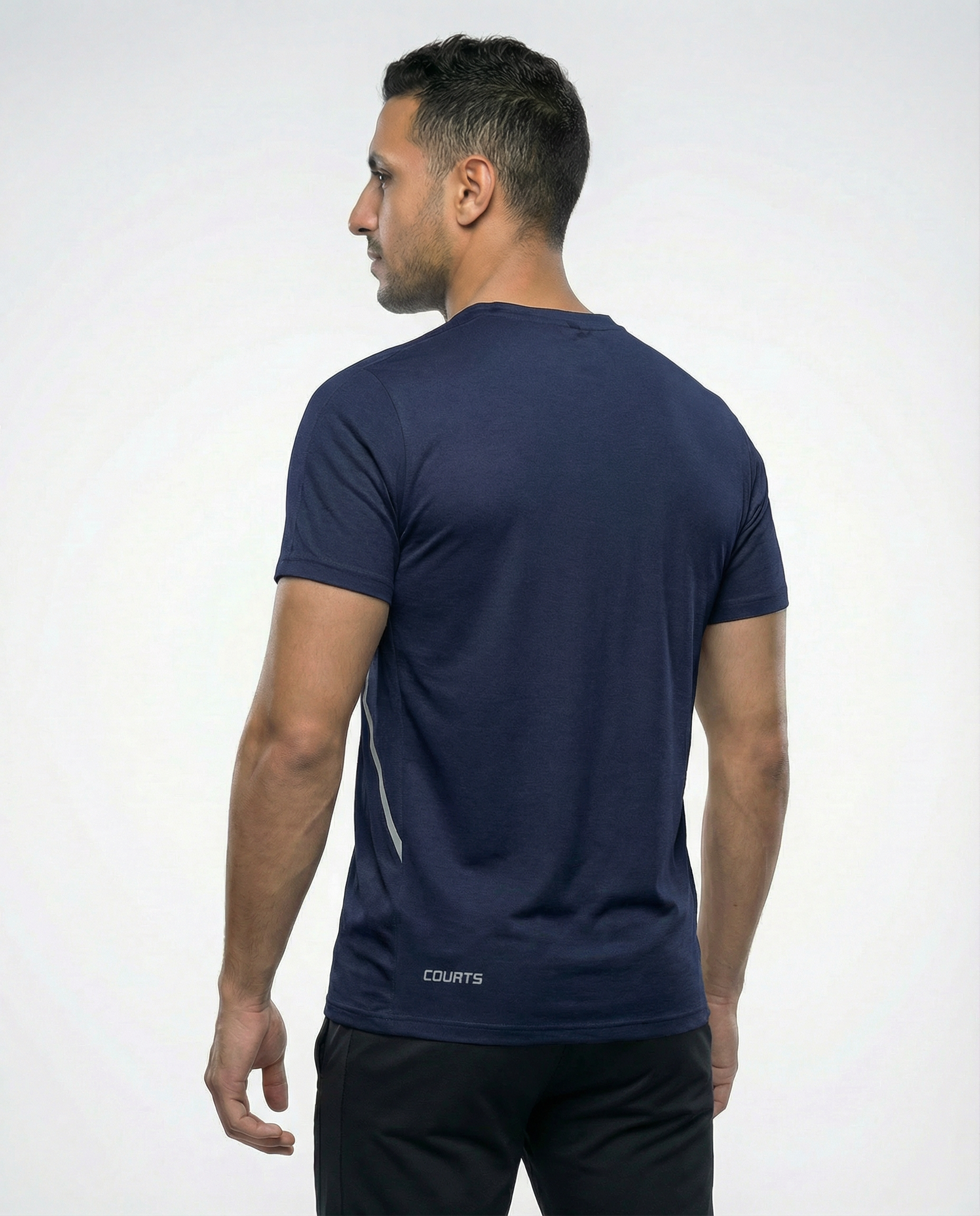 Man wearing a navy blue athletic shirt with a logo on a white background
Courts Sport
