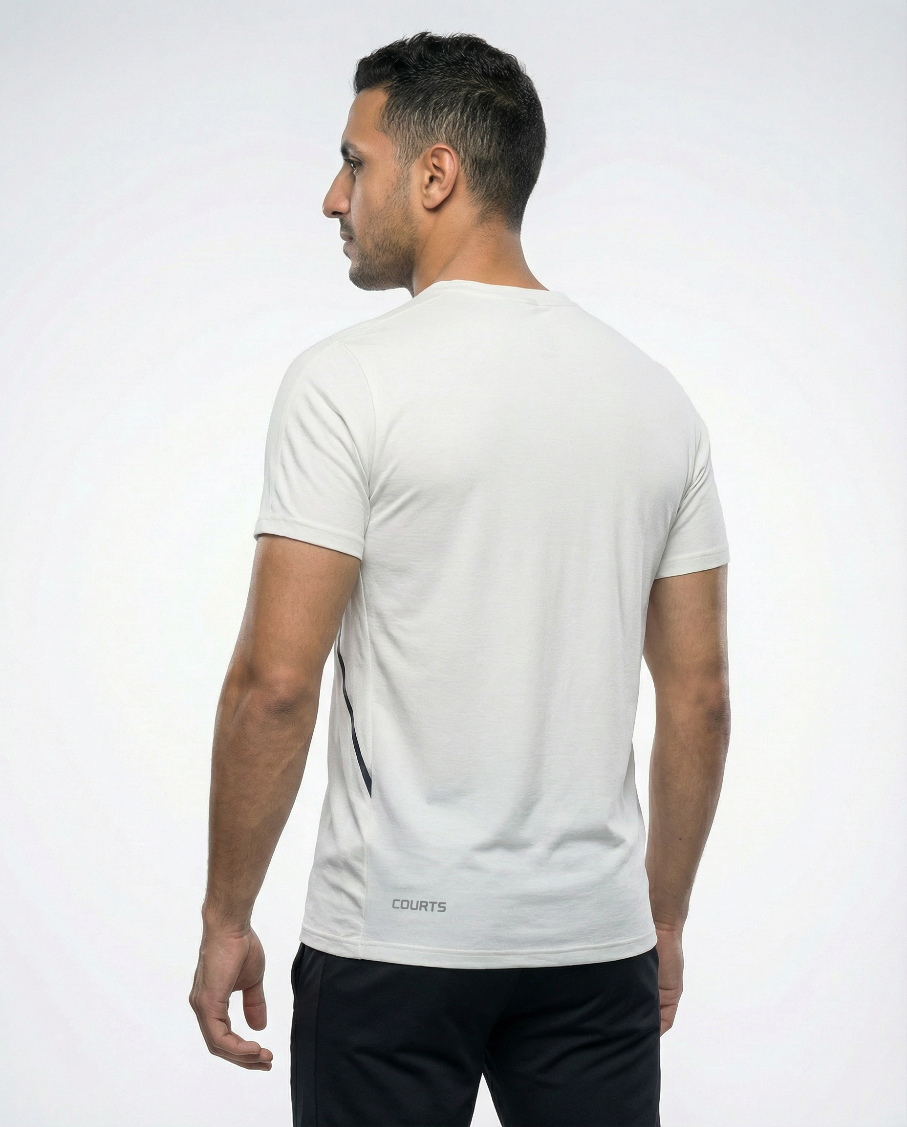 Man wearing a white t-shirt with a logo on a white background
Courts Sport