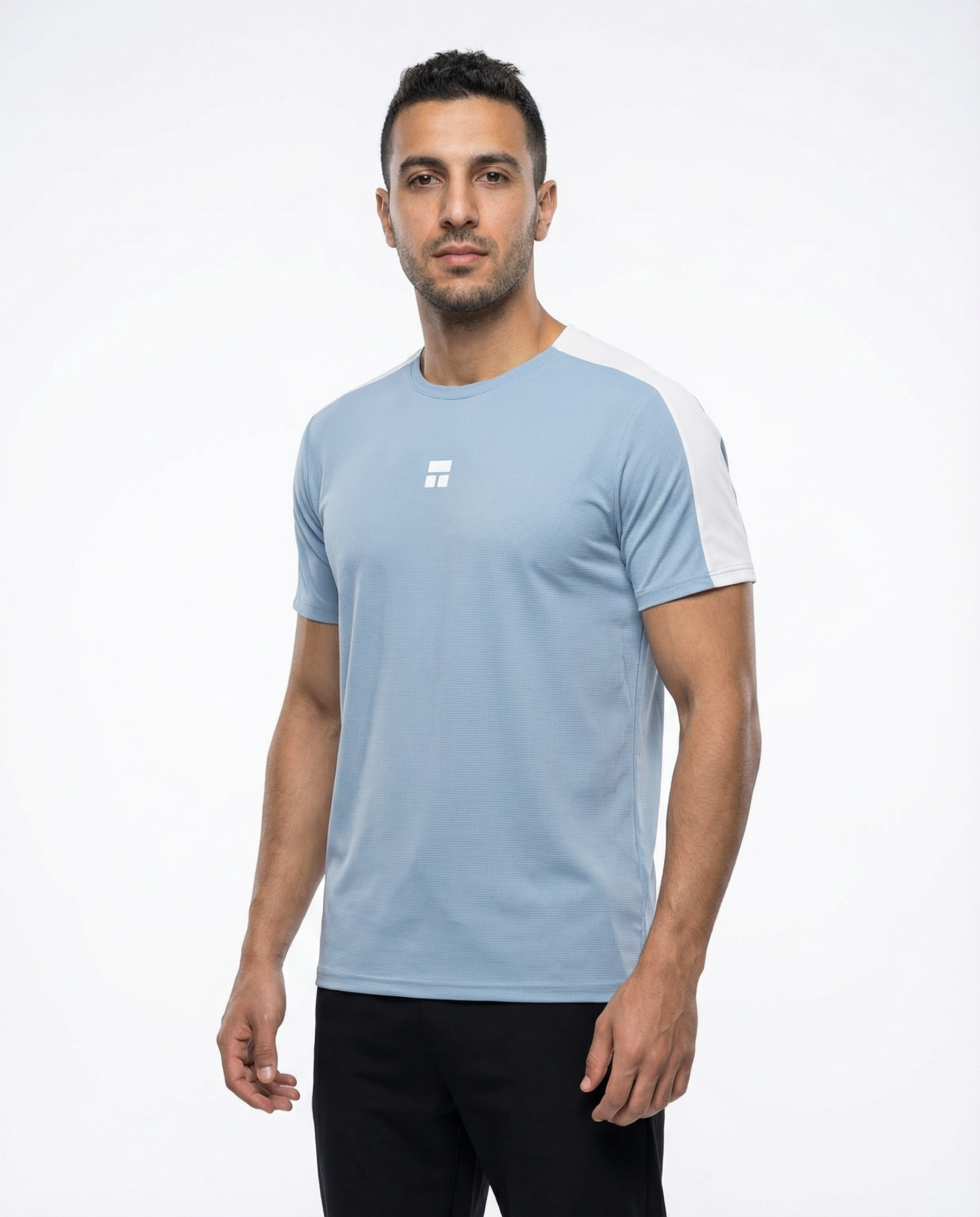 Man wearing a light blue and white t-shirt on a plain background
Courts Sport