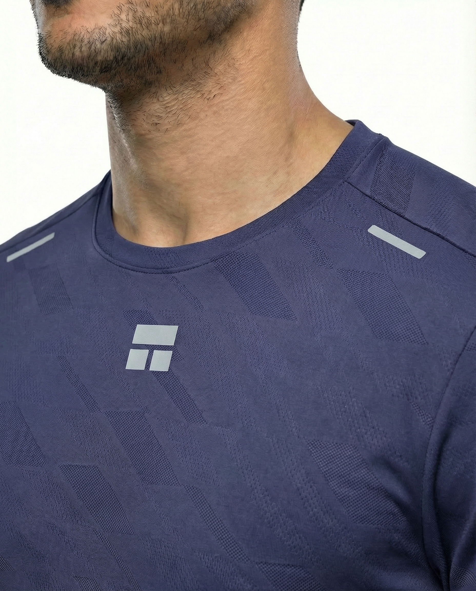 Man wearing a blue courts athletic shirt with a logo on a white background