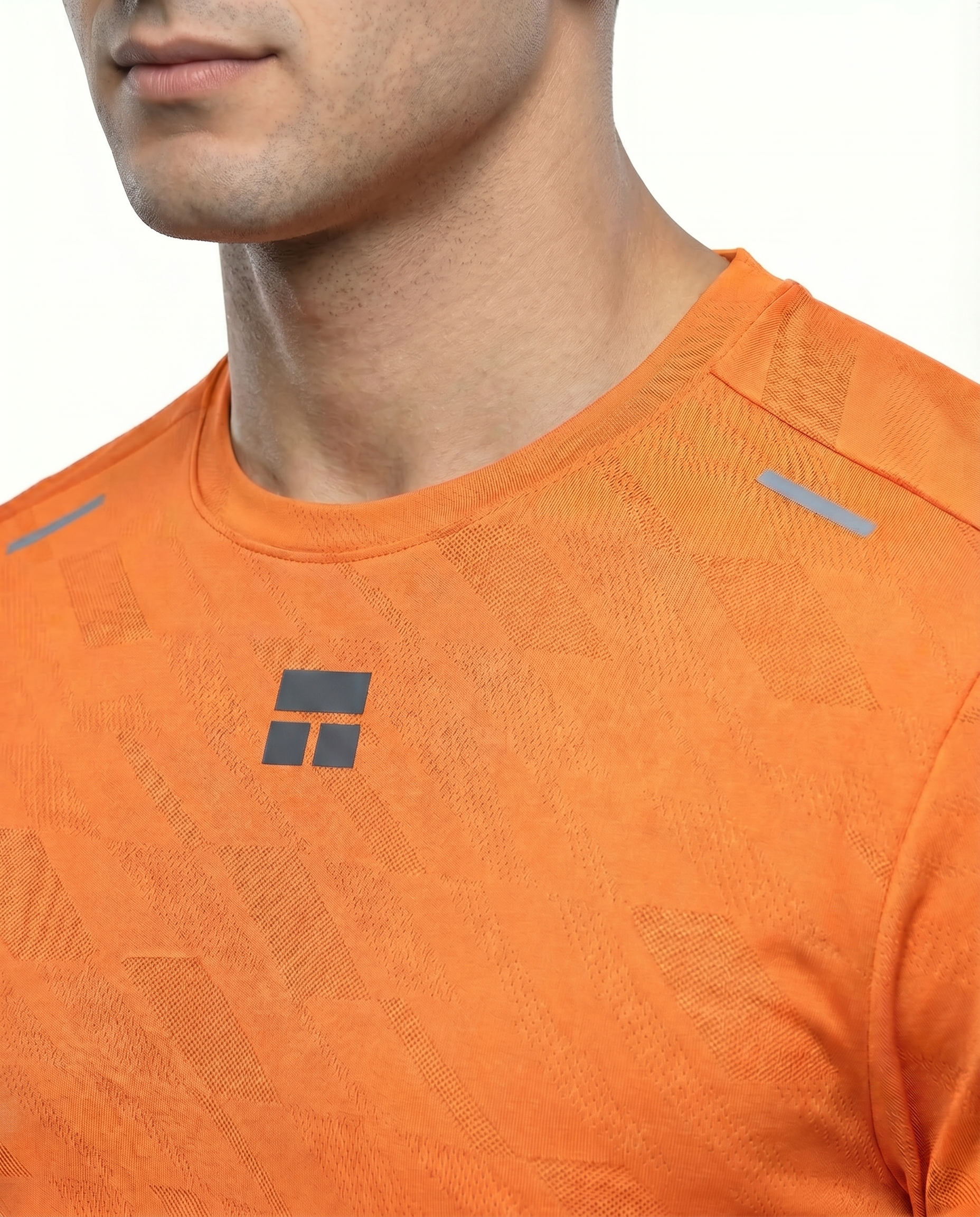 Man wearing a courts sport orange t-shirt with a logo on a white background