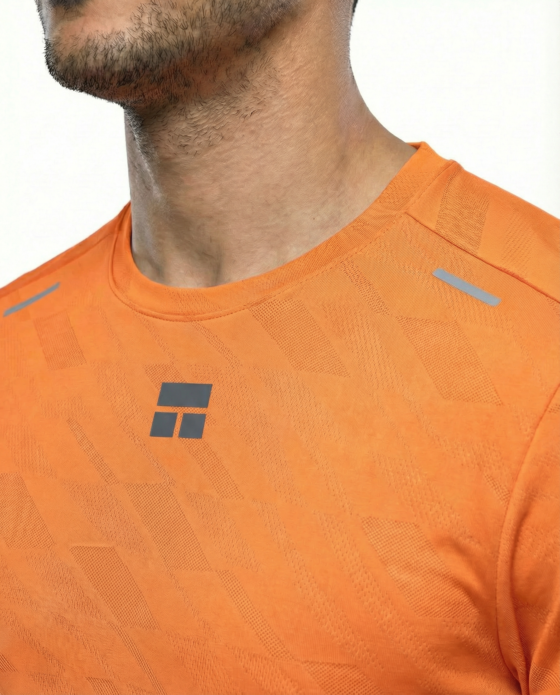 Man wearing a courts sport orange t-shirt with a logo on a white background