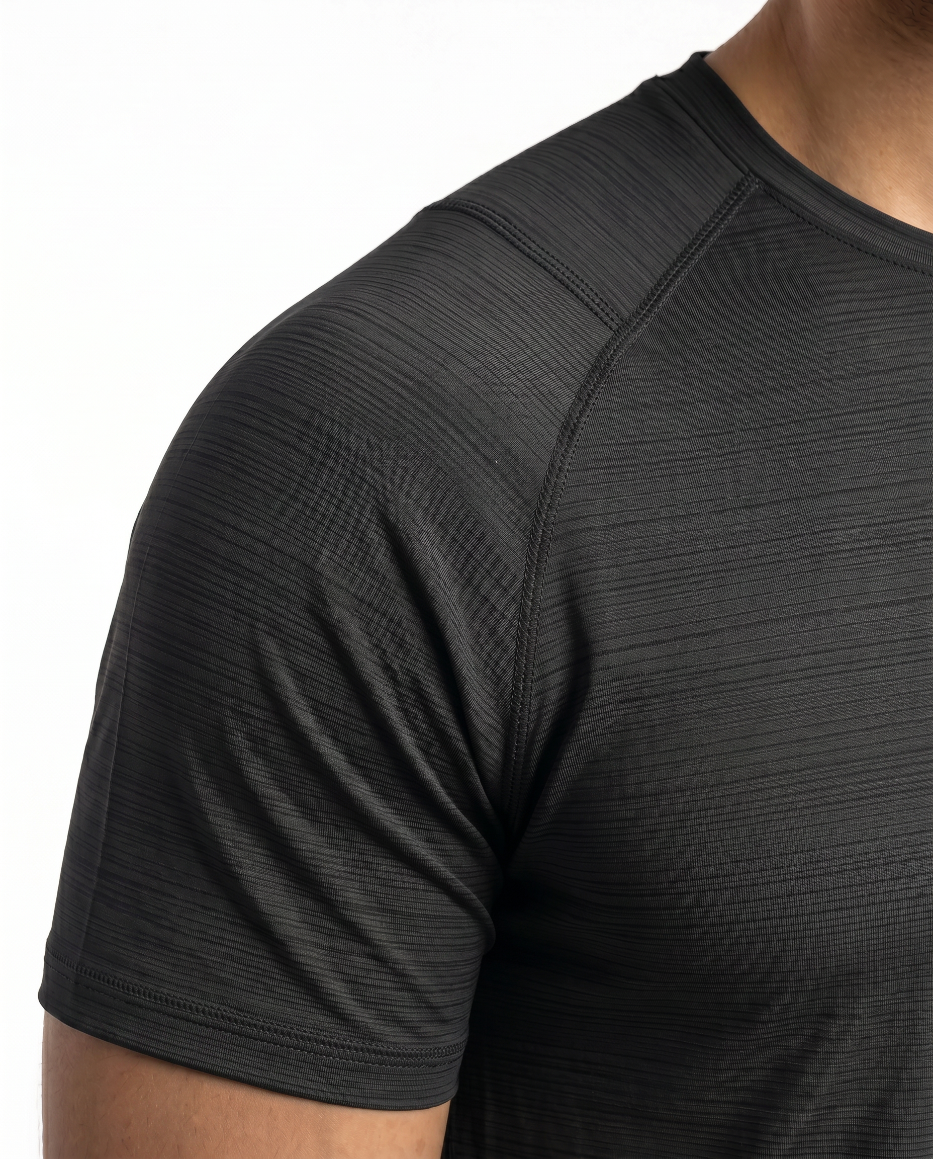 Man wearing a black athletic outfit with a logo on a white background