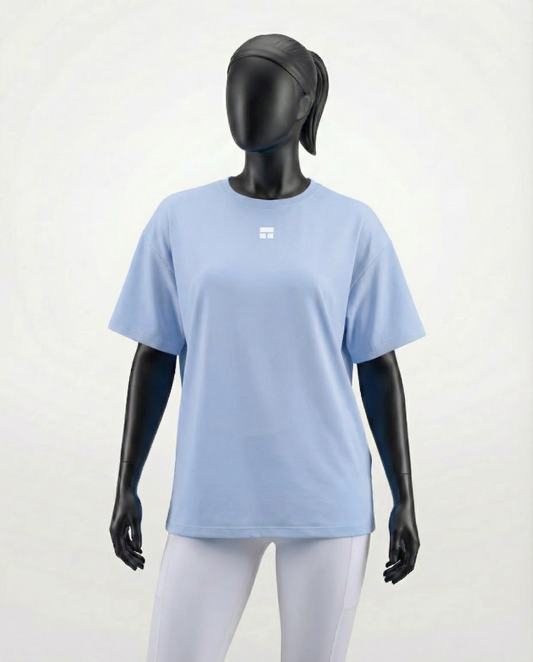 Mannequin wearing an oversized light blue t-shirt on a white background
