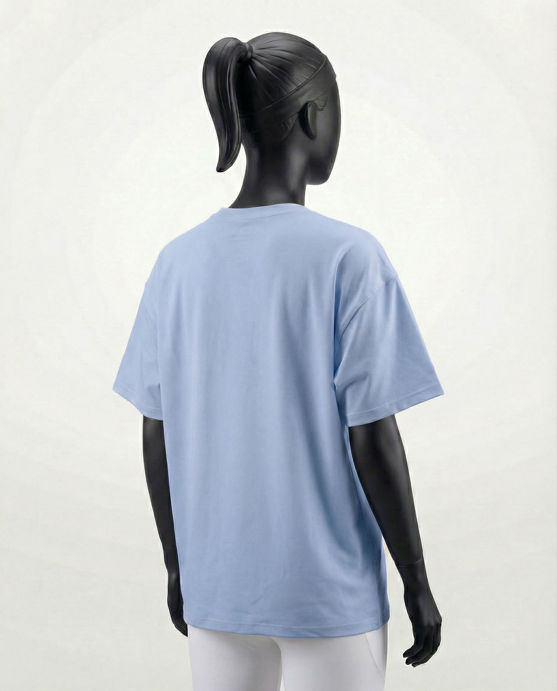 Mannequin wearing an oversized light blue t-shirt on a white background