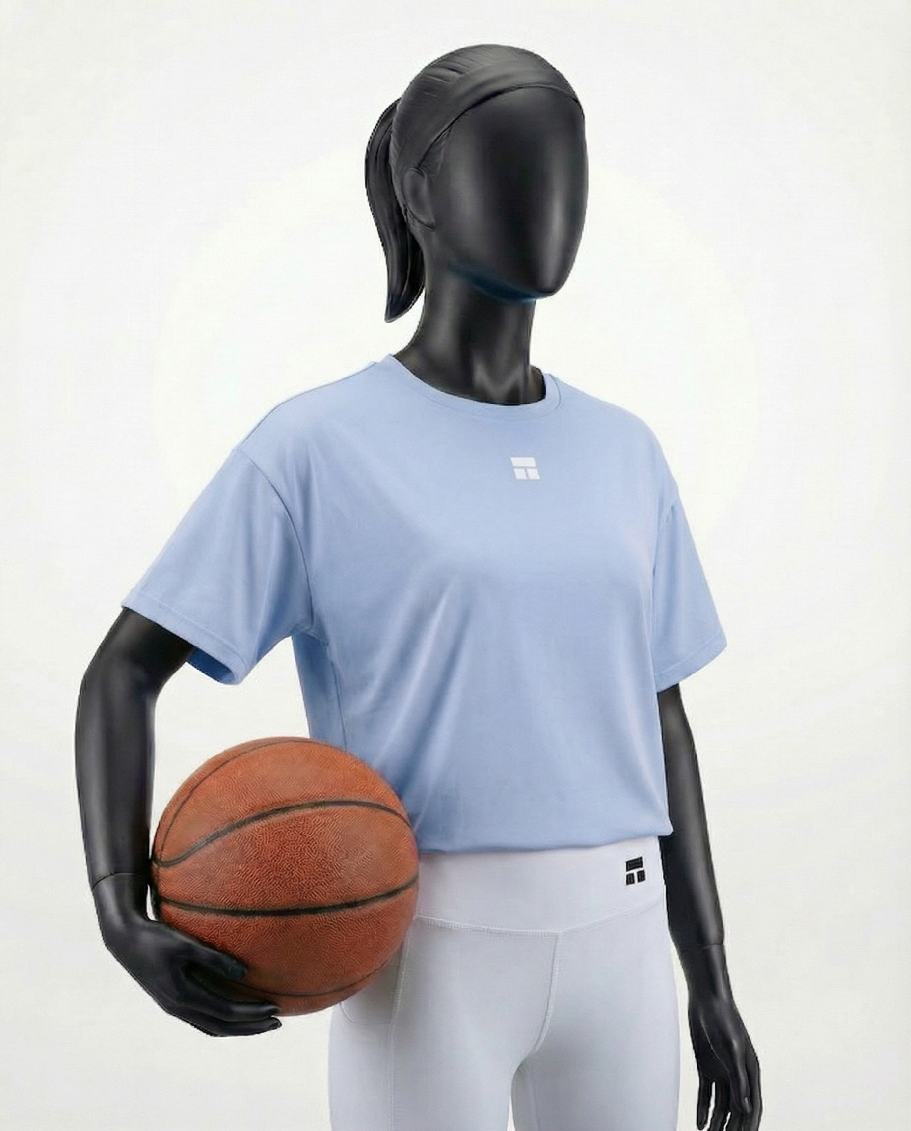 Mannequin wearing an oversized light blue t-shirt on a white background