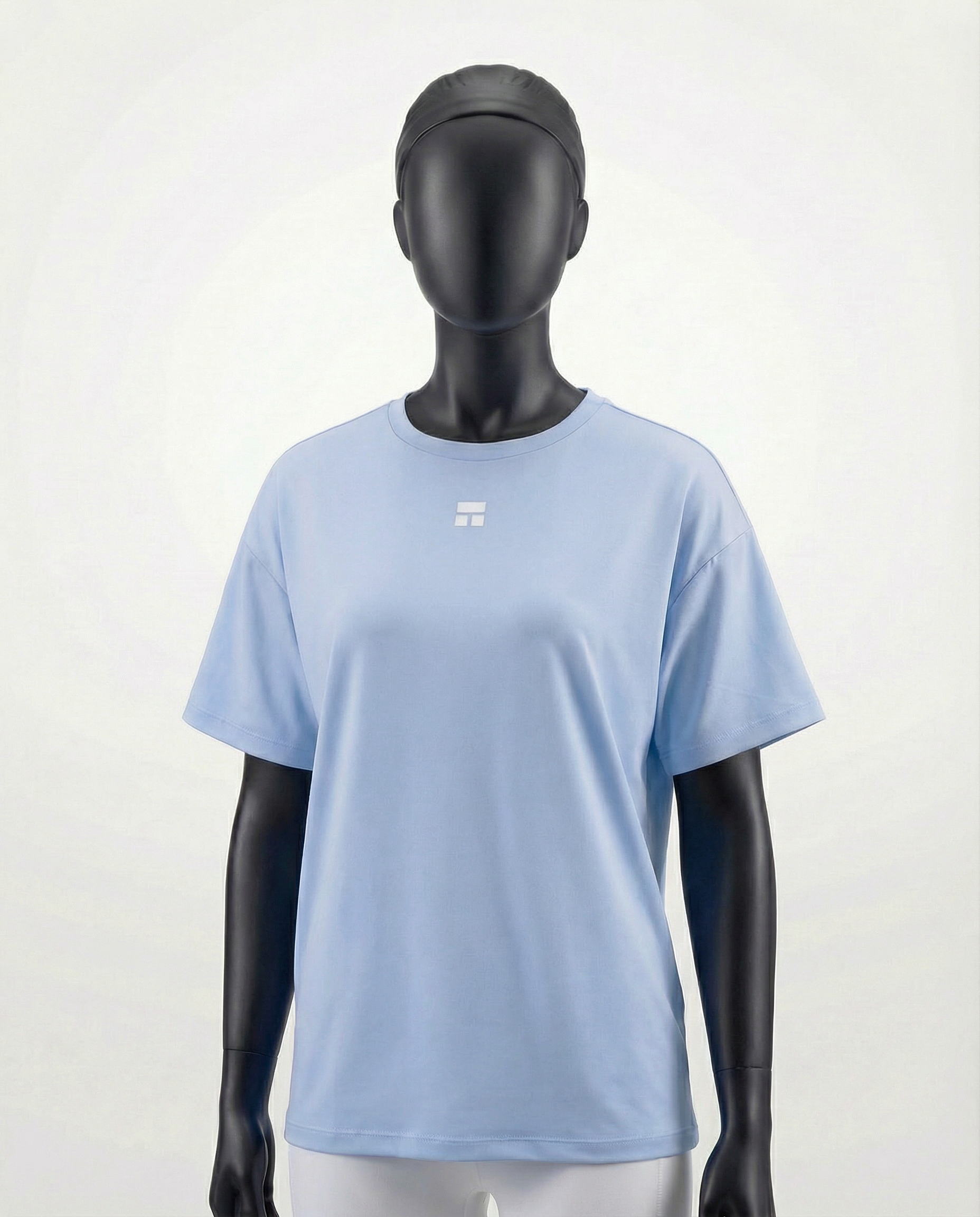 Mannequin wearing an oversized light blue t-shirt on a white background