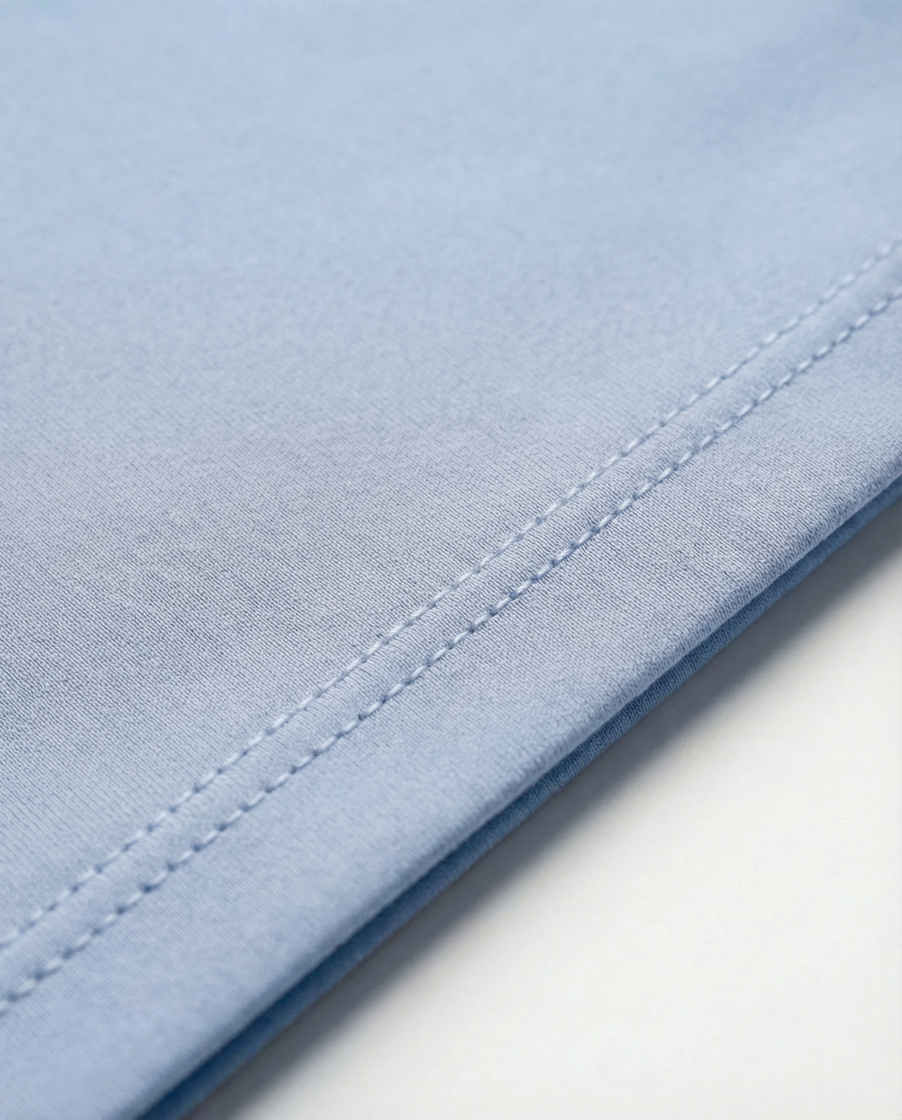 Mannequin wearing an oversized light blue t-shirt on a white background