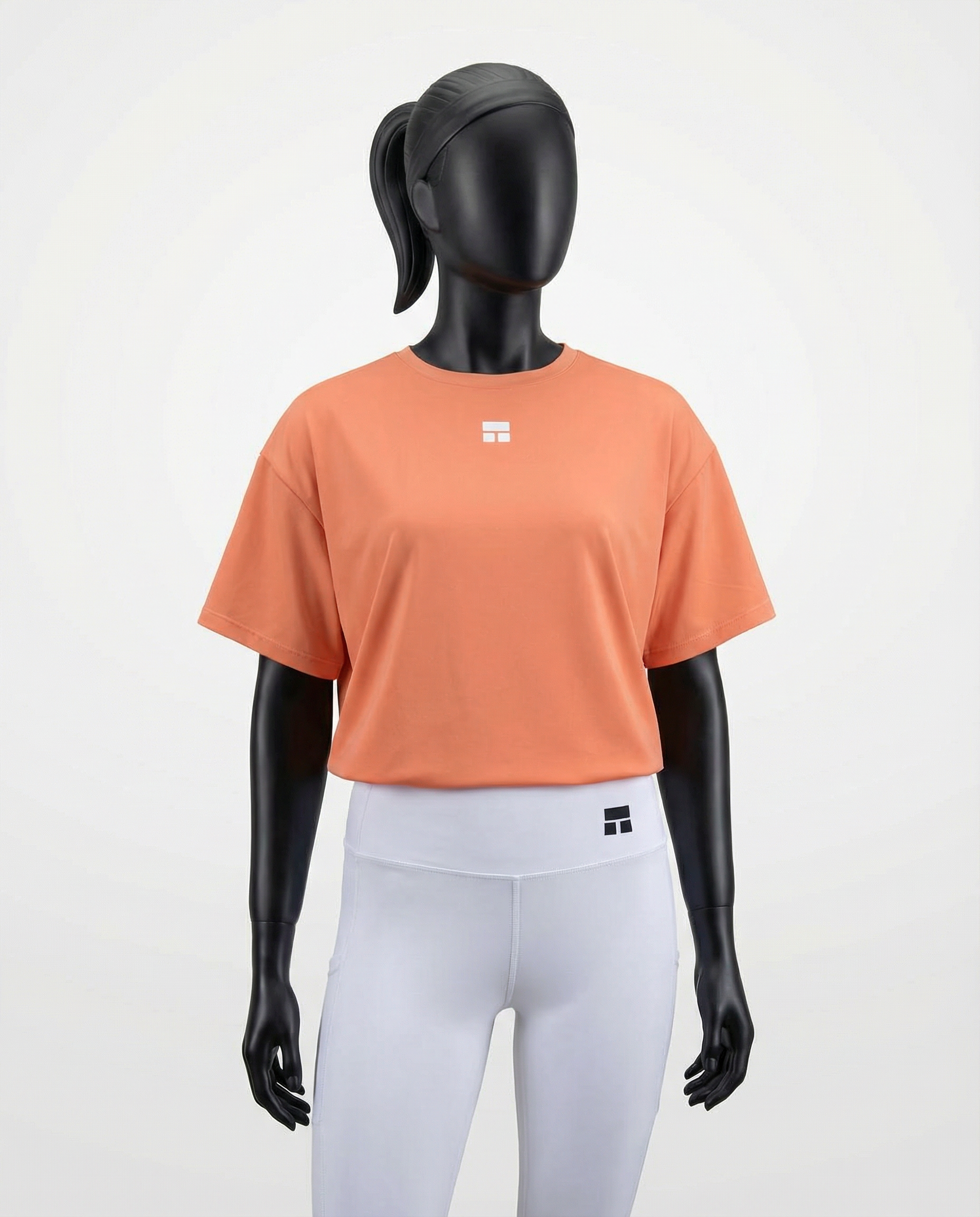 Oversized women’s T-shirt with a relaxed silhouette, short sleeves, and smooth lightweight fabric, designed for breathable comfort and effortless everyday styling on a mannequin.