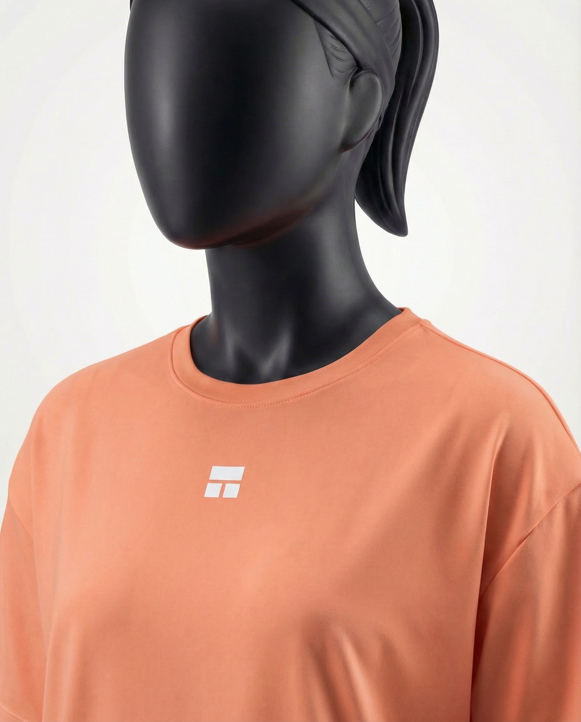 Oversized women’s T-shirt with a relaxed silhouette, short sleeves, and smooth lightweight fabric, designed for breathable comfort and effortless everyday styling on a mannequin.