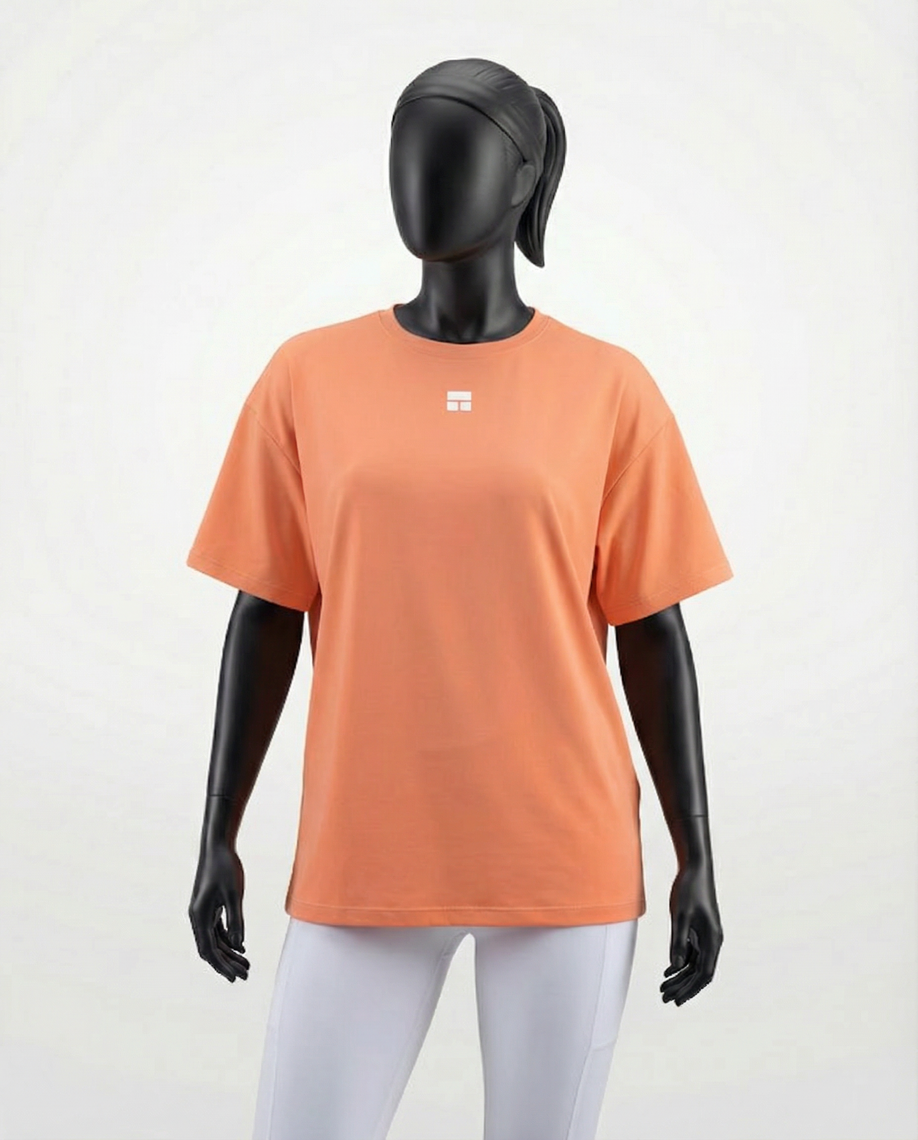 Oversized women’s T-shirt with a relaxed silhouette, short sleeves, and smooth lightweight fabric, designed for breathable comfort and effortless everyday styling on a mannequin.
