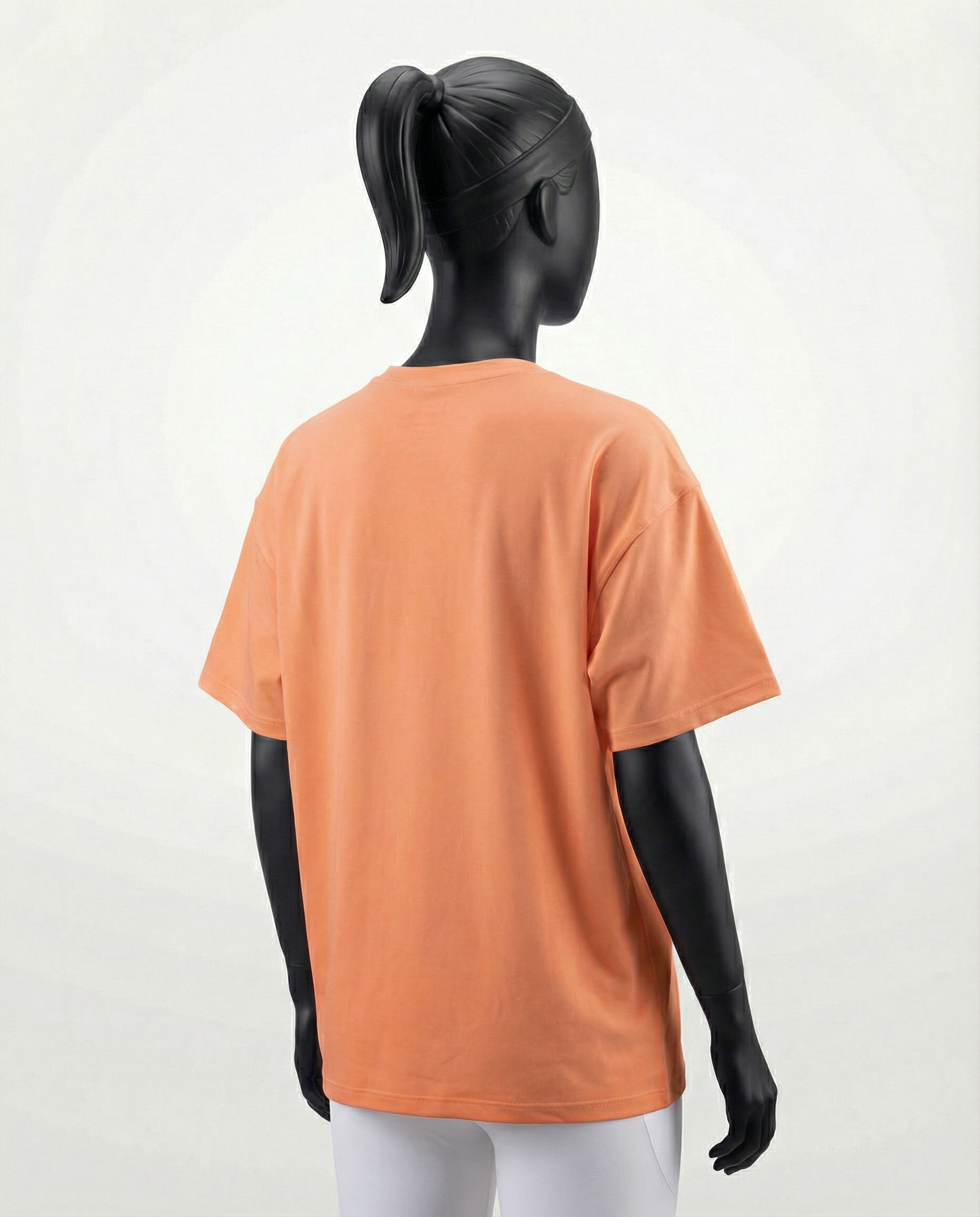 Oversized women’s T-shirt with a relaxed silhouette, short sleeves, and smooth lightweight fabric, designed for breathable comfort and effortless everyday styling on a mannequin.