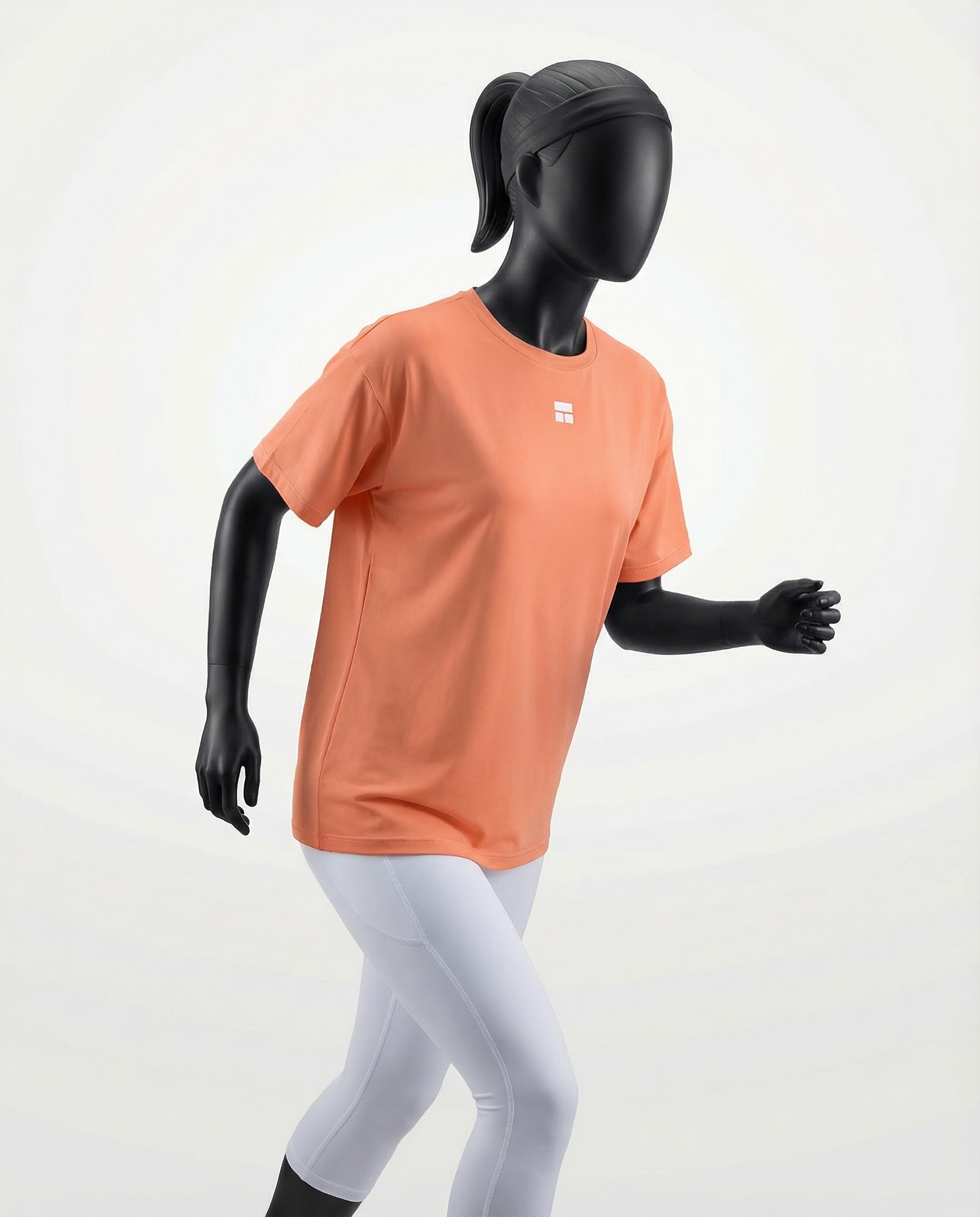 Oversized women’s T-shirt with a relaxed silhouette, short sleeves, and smooth lightweight fabric, designed for breathable comfort and effortless everyday styling on a mannequin.