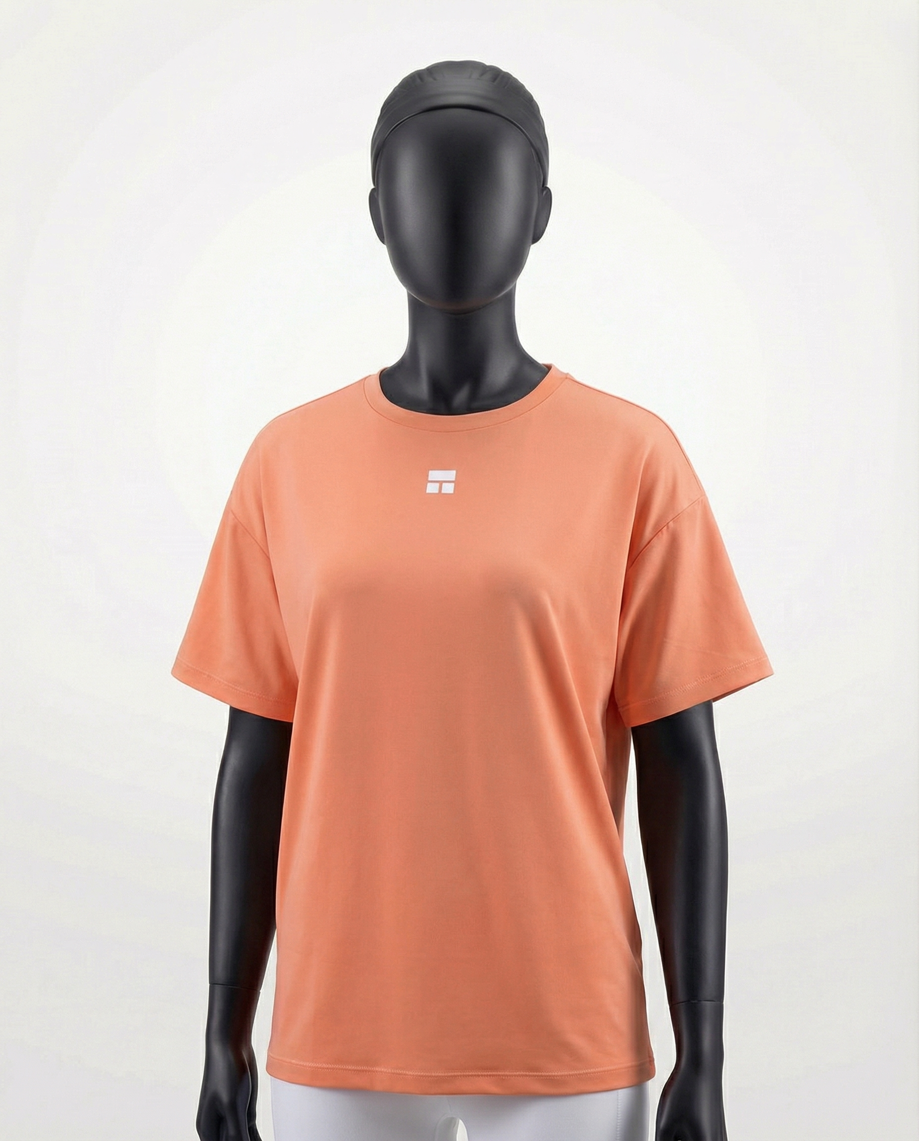 Oversized women’s T-shirt with a relaxed silhouette, short sleeves, and smooth lightweight fabric, designed for breathable comfort and effortless everyday styling on a mannequin.
