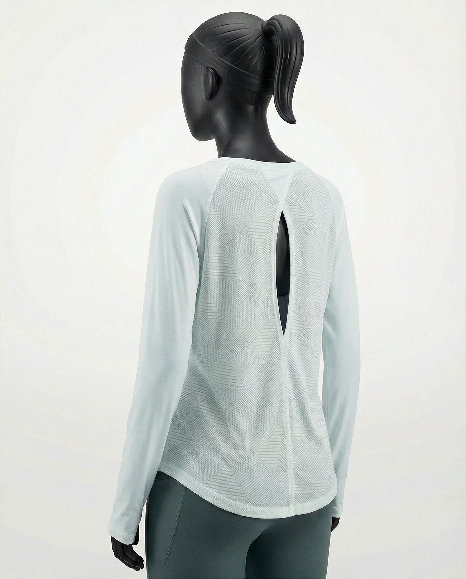 Mannequin wearing a light gray long-sleeve top with a cutout design on a white background