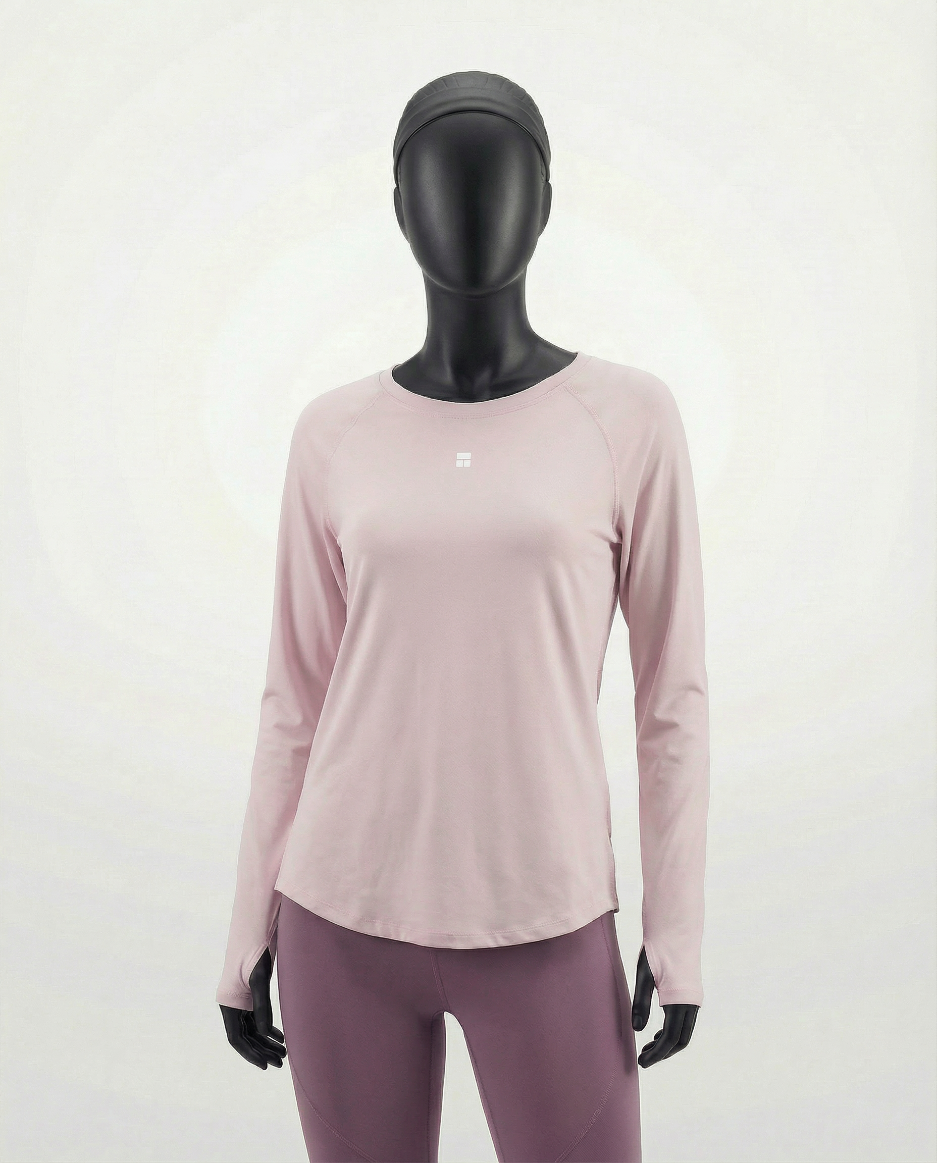 Mannequin wearing a pink long-sleeve top with a cut-out design on a white background