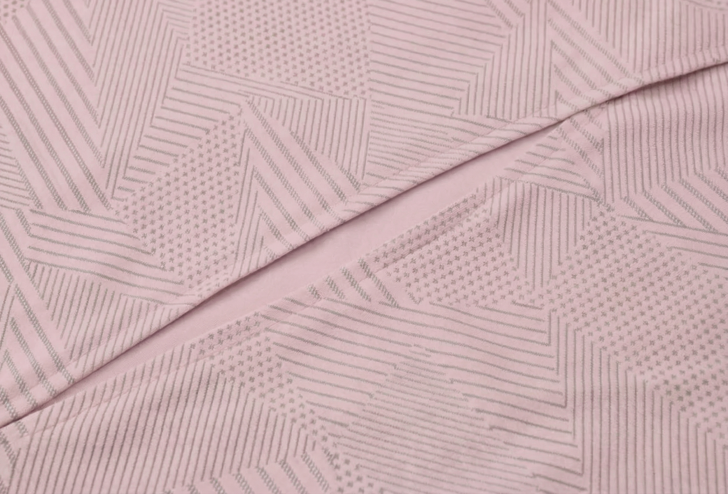 Mannequin wearing a pink long-sleeve top with a cut-out design on a white background