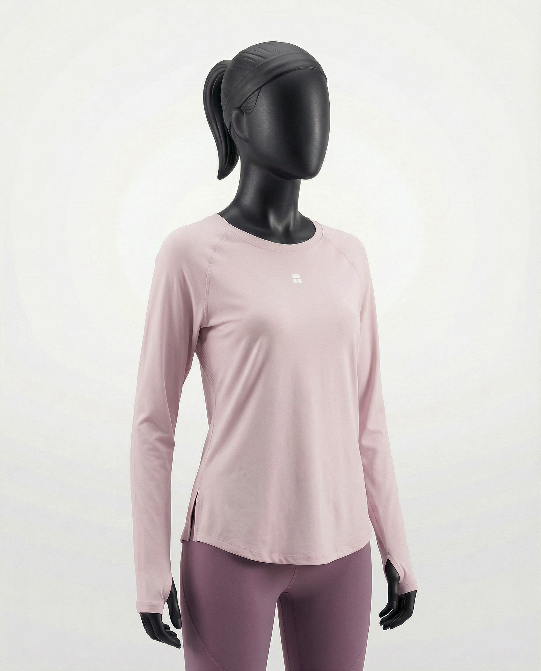 Mannequin wearing a pink long-sleeve top with a cut-out design on a white background