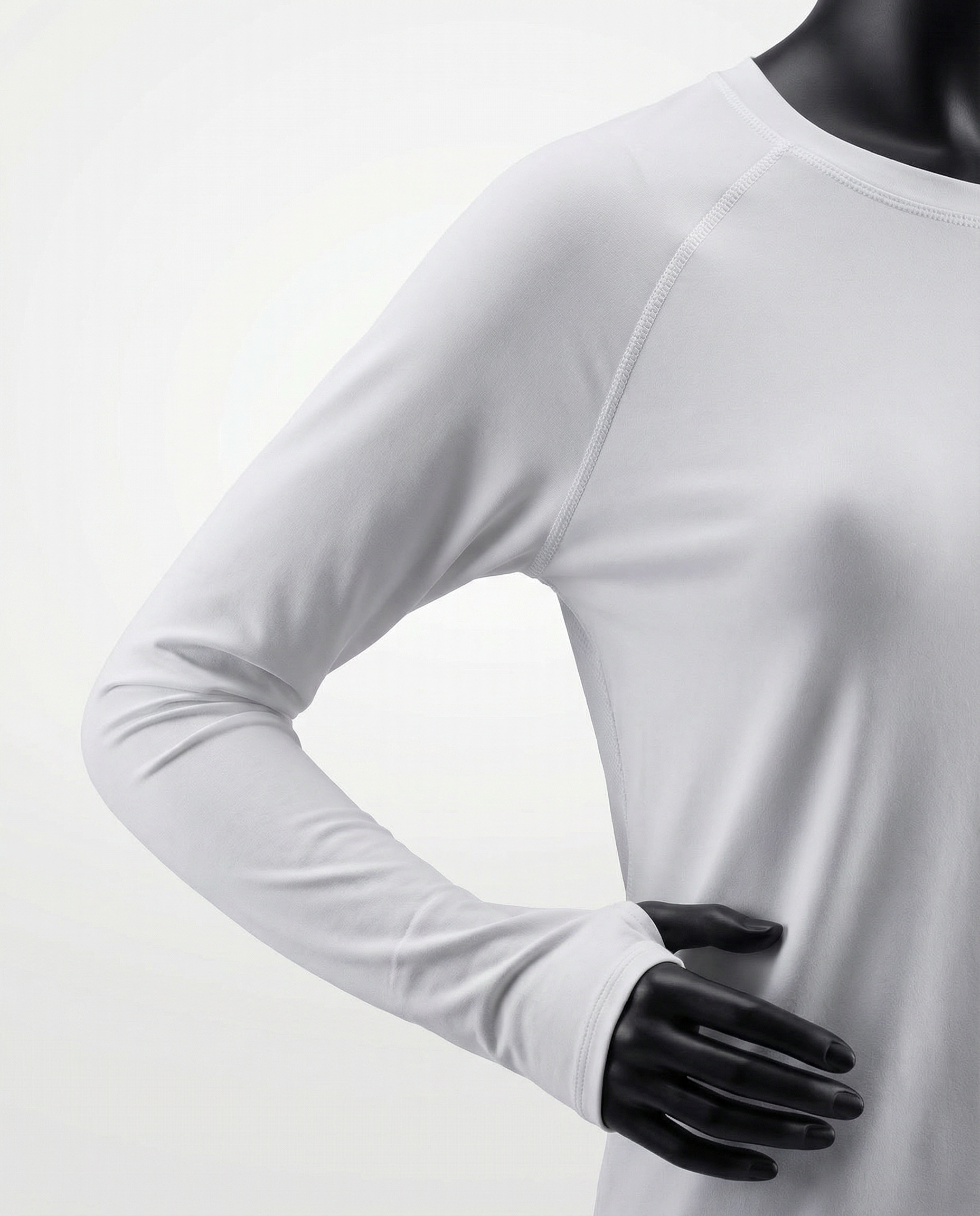 Mannequin wearing a white long-sleeve top with a cutout design on a white background